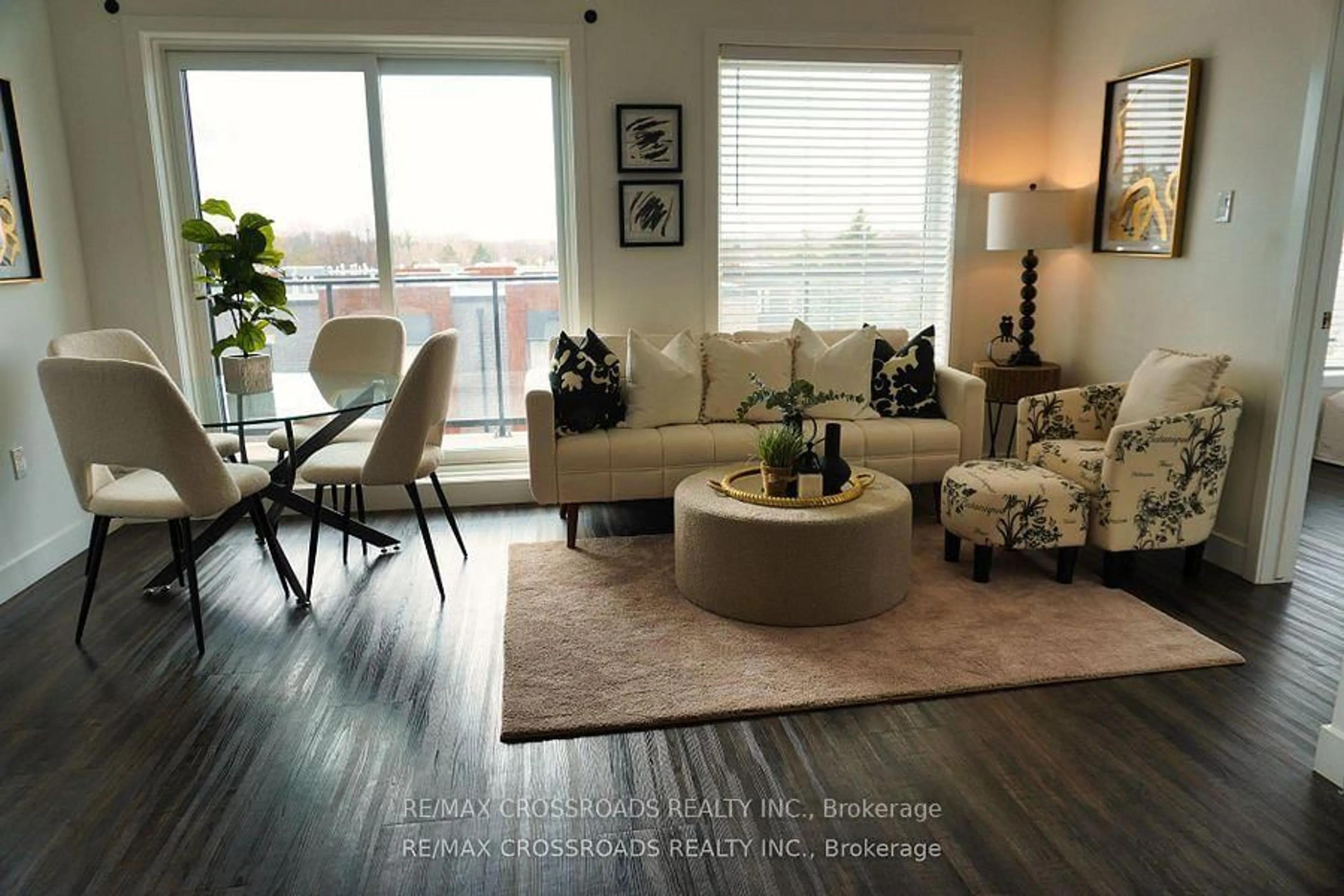 Living room with furniture, wood/laminate floor for 408 Dundas St #308, Cambridge Ontario N1R 0E8