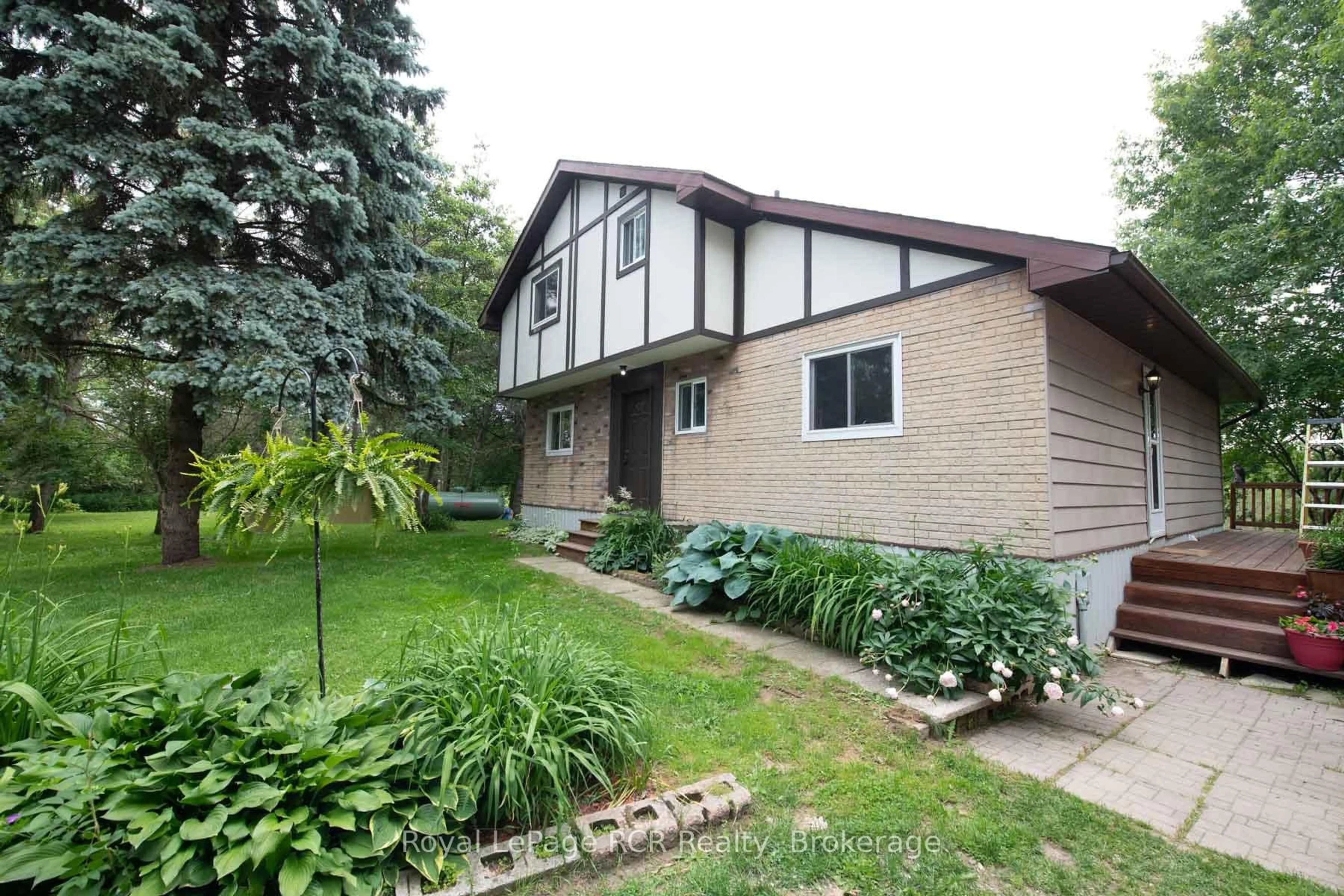 Home with vinyl exterior material, street for 7589 HIGHWAY 89, Wellington North Ontario N0G 2L0