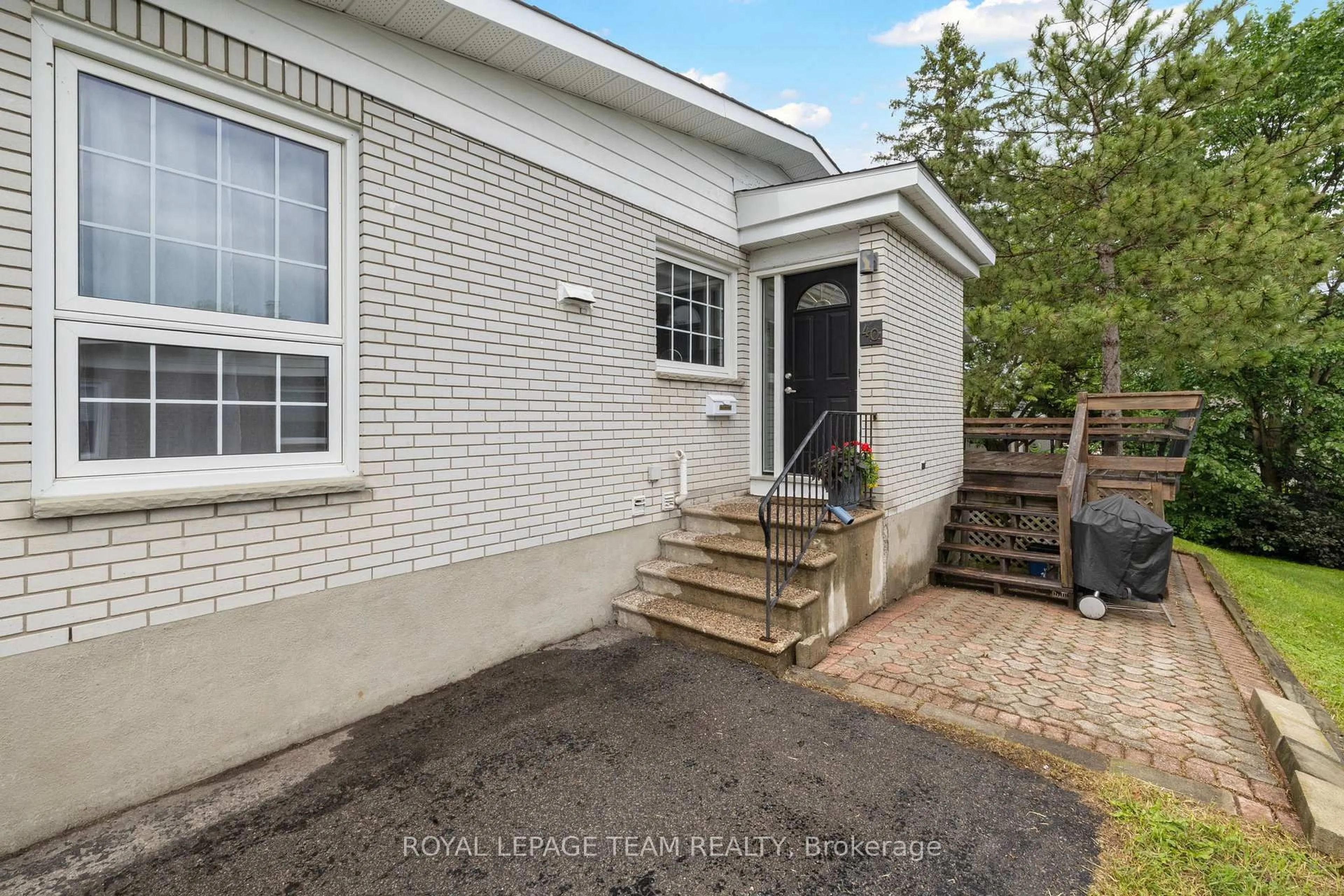 Home with brick exterior material, street for 40 Woodmount Cres, Ottawa Ontario K2E 5R1