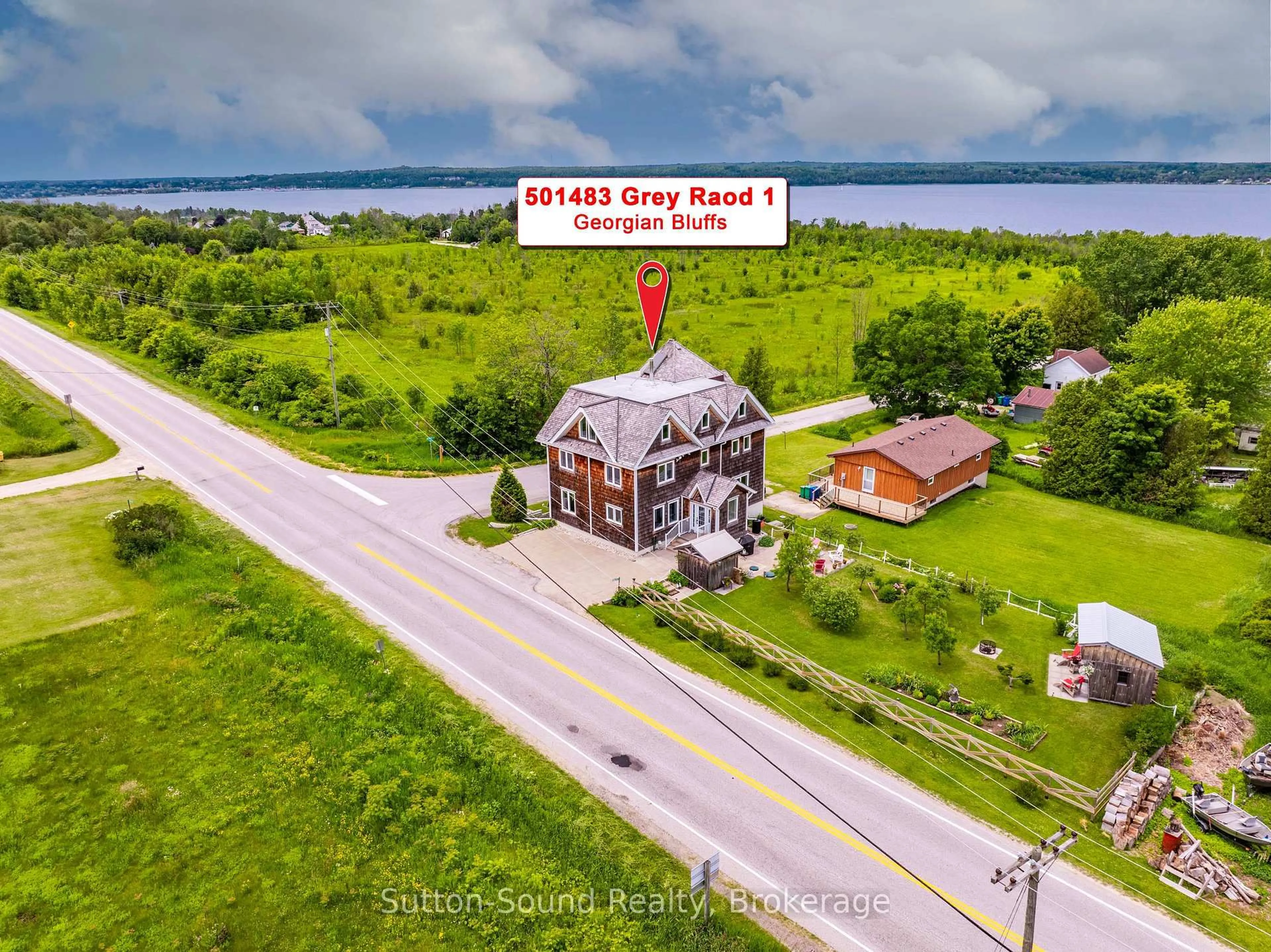A pic from outside/outdoor area/front of a property/back of a property/a pic from drone, water/lake/river/ocean view for 501483 Grey Road 1 Rd, Georgian Bluffs Ontario N0H 2T0