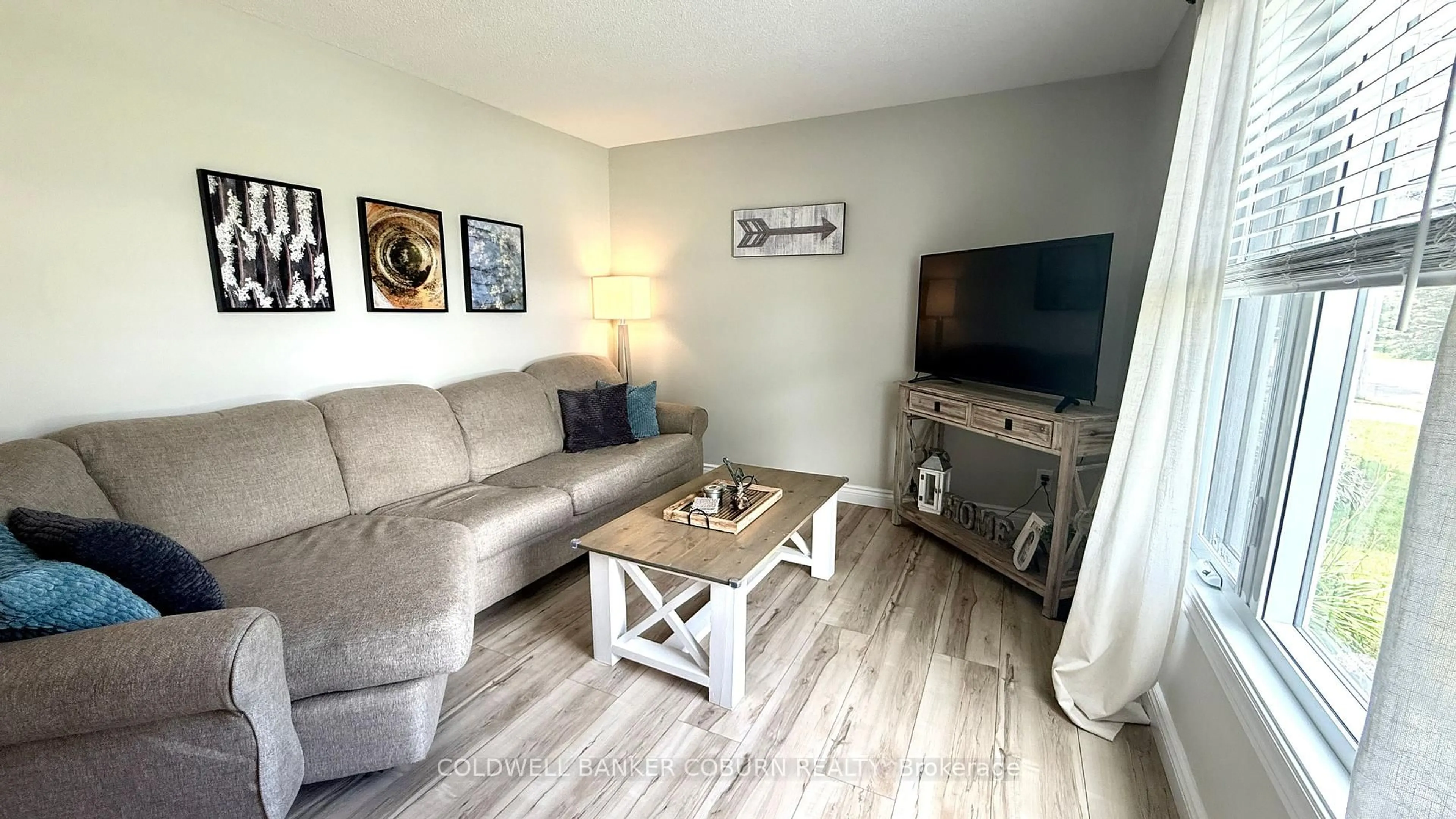 Living room with furniture, wood/laminate floor for 96 Mississippi Rd, Carleton Place Ontario K7C 4E4