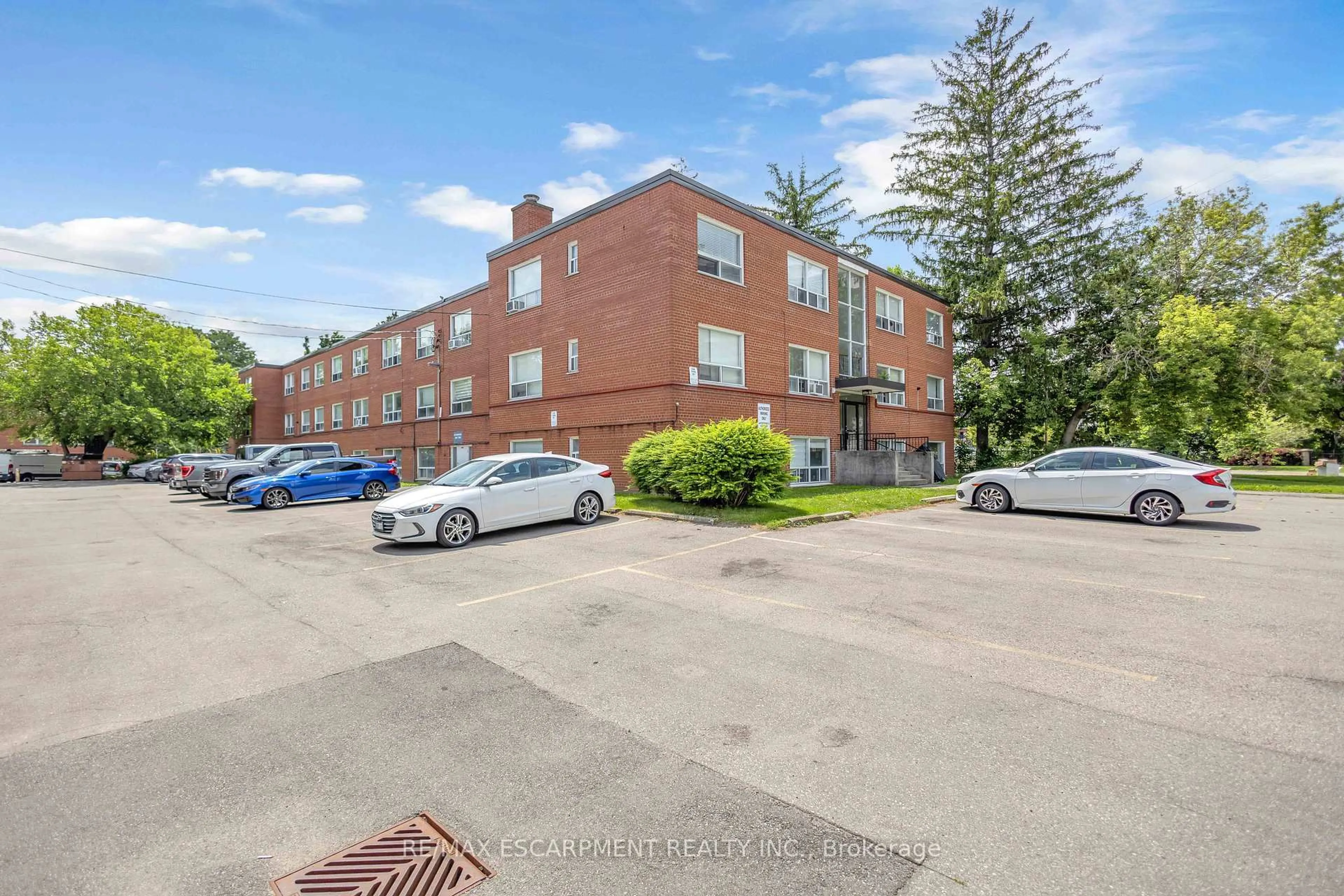 A pic from outside/outdoor area/front of a property/back of a property/a pic from drone, street for 57 Mericourt Rd #302, Hamilton Ontario L8S 2N5