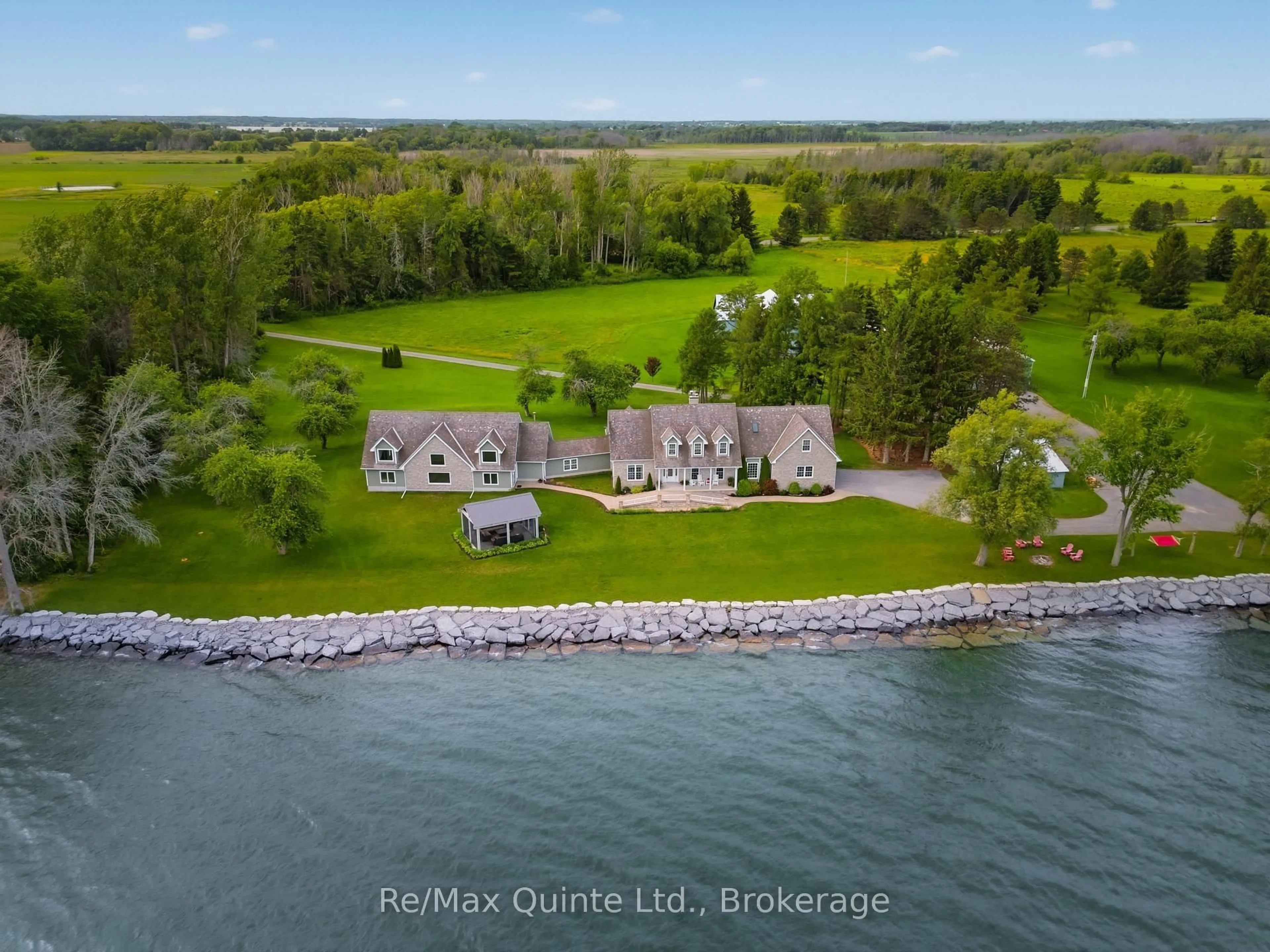 A pic from outside/outdoor area/front of a property/back of a property/a pic from drone, water/lake/river/ocean view for 4698 County Road 8, Prince Edward County Ontario K0K 2T0