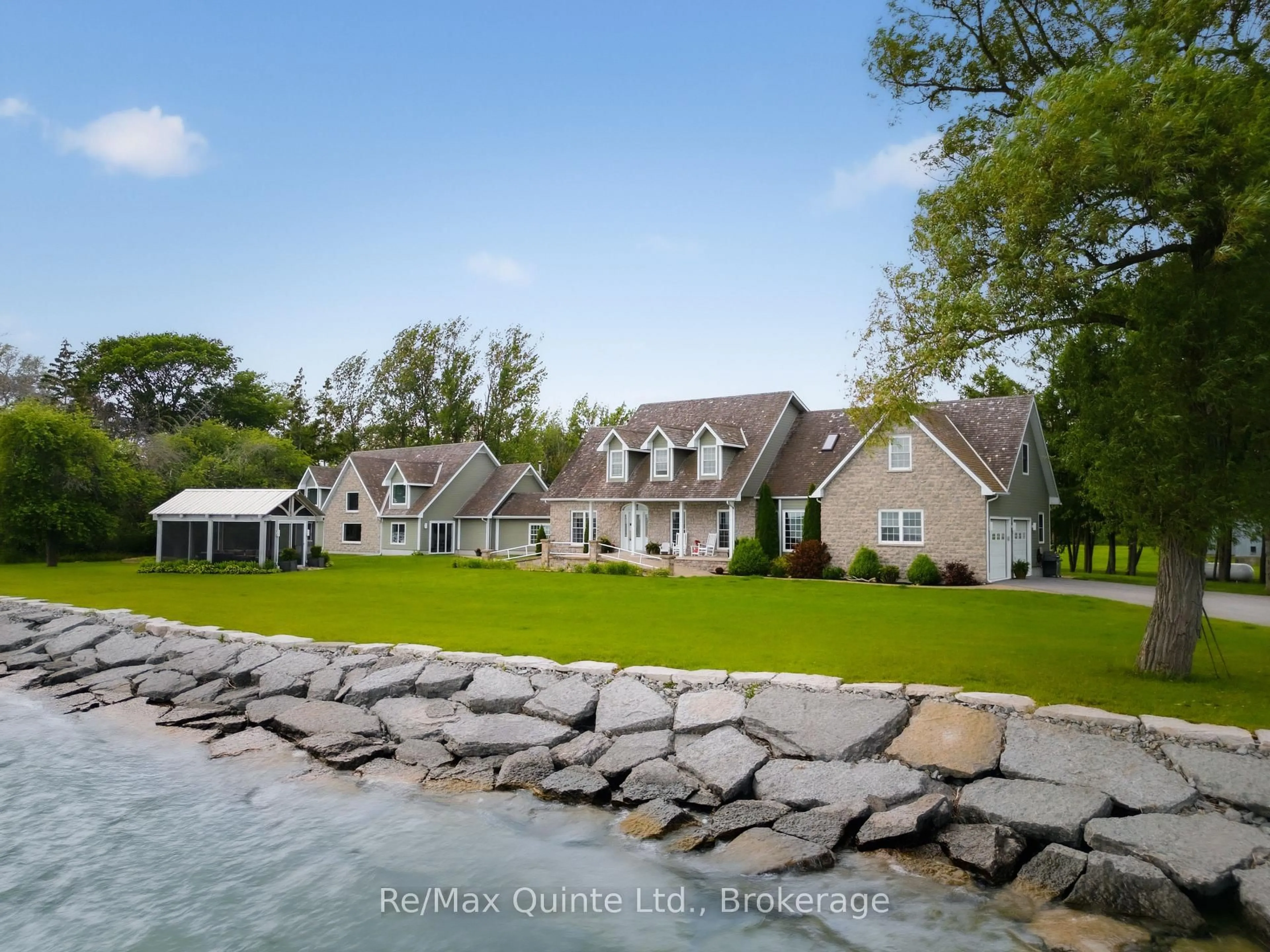 A pic from outside/outdoor area/front of a property/back of a property/a pic from drone, water/lake/river/ocean view for 4698 County Road 8, Prince Edward County Ontario K0K 2T0