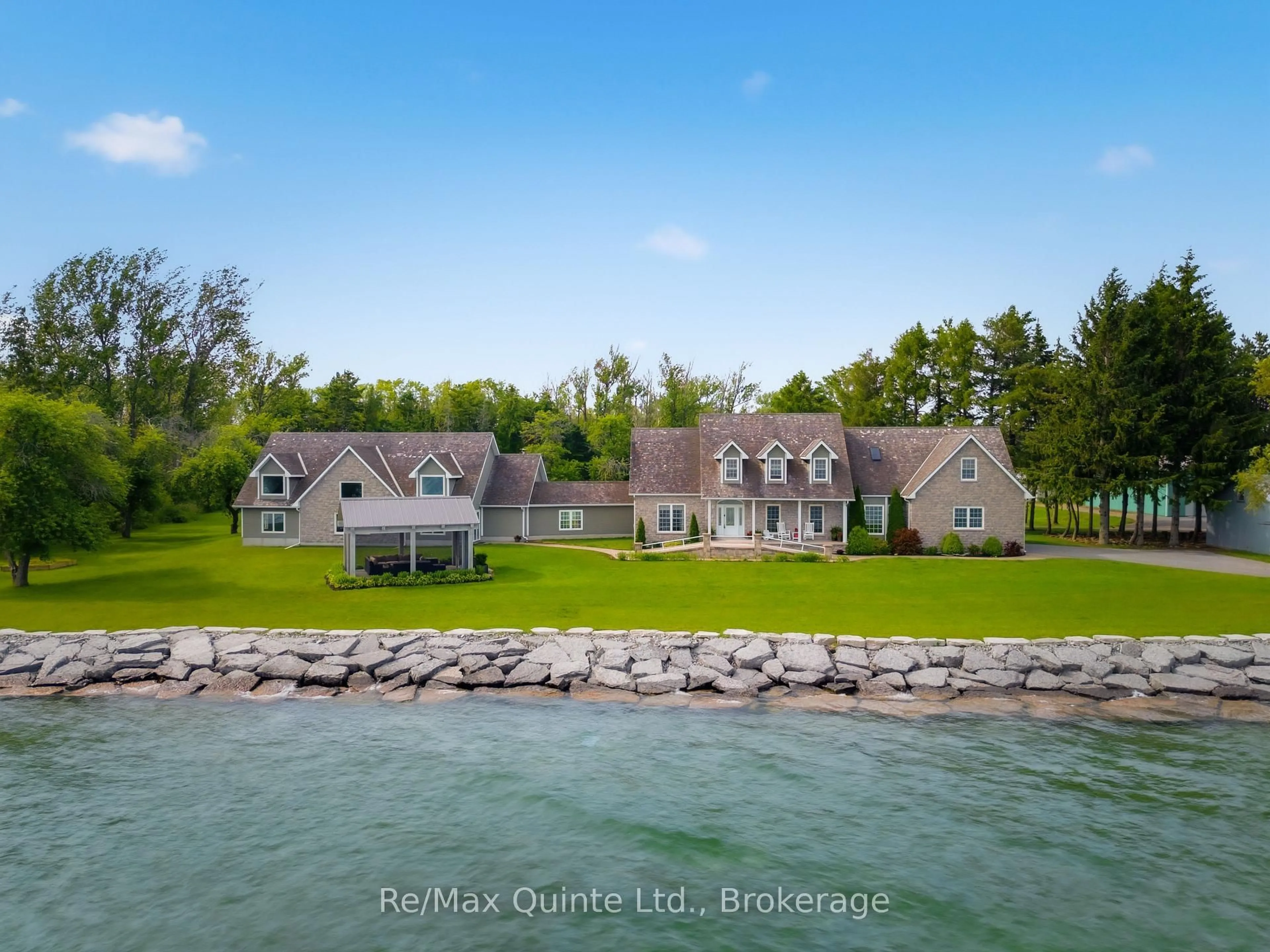 A pic from outside/outdoor area/front of a property/back of a property/a pic from drone, water/lake/river/ocean view for 4698 County Road 8, Prince Edward County Ontario K0K 2T0
