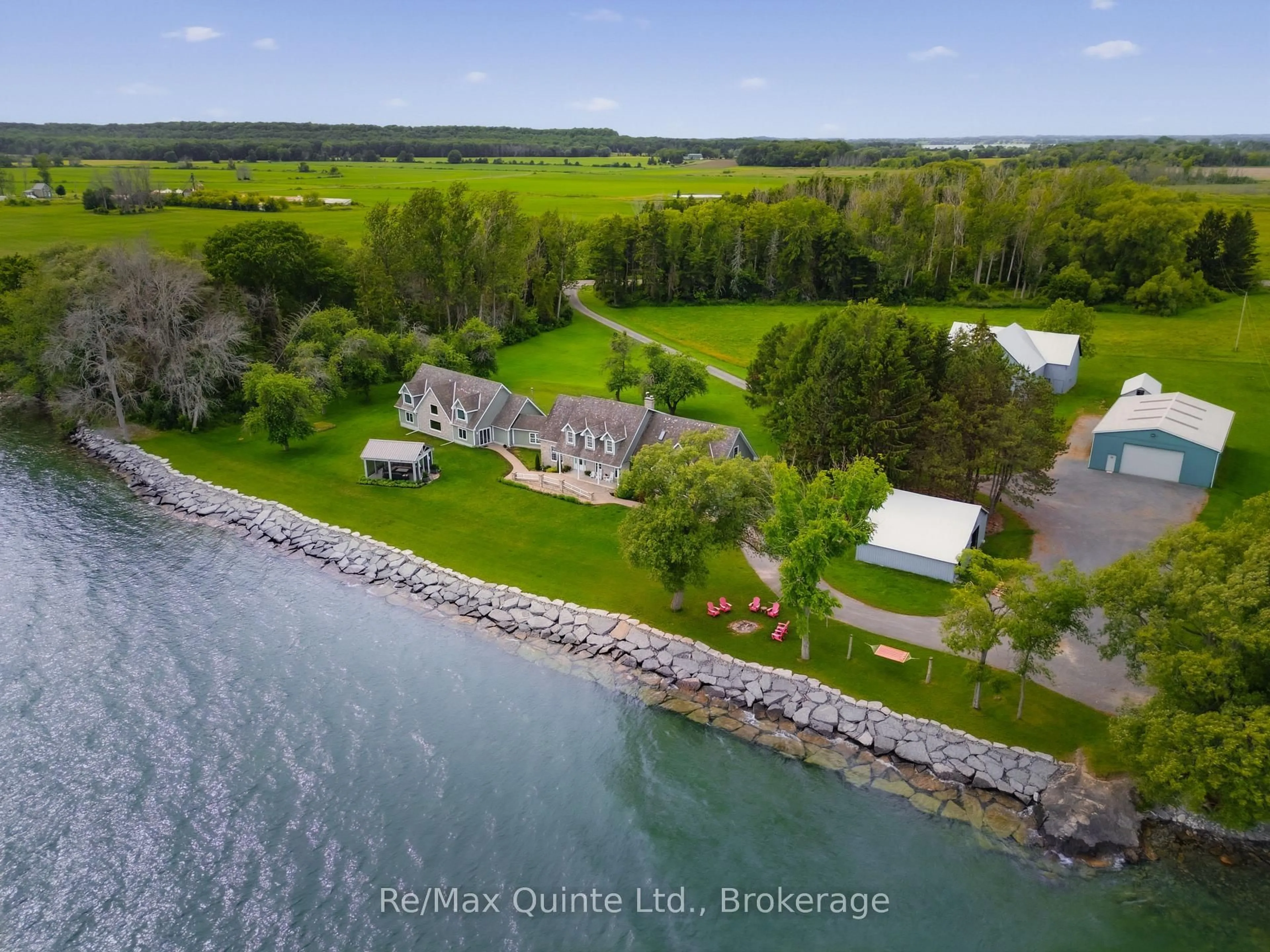 A pic from outside/outdoor area/front of a property/back of a property/a pic from drone, water/lake/river/ocean view for 4698 County Road 8, Prince Edward County Ontario K0K 2T0