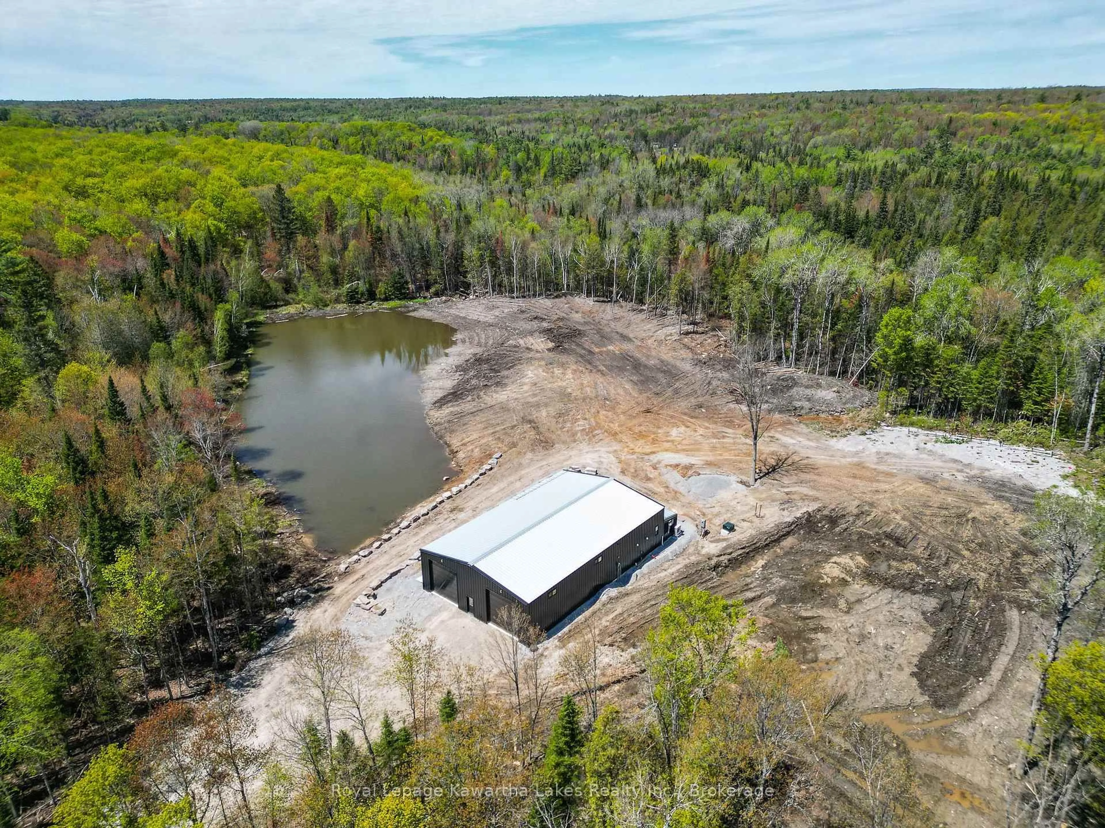 A pic from outside/outdoor area/front of a property/back of a property/a pic from drone, water/lake/river/ocean view for 1851 Contau Lake Rd, Highlands East Ontario K0M 1R0