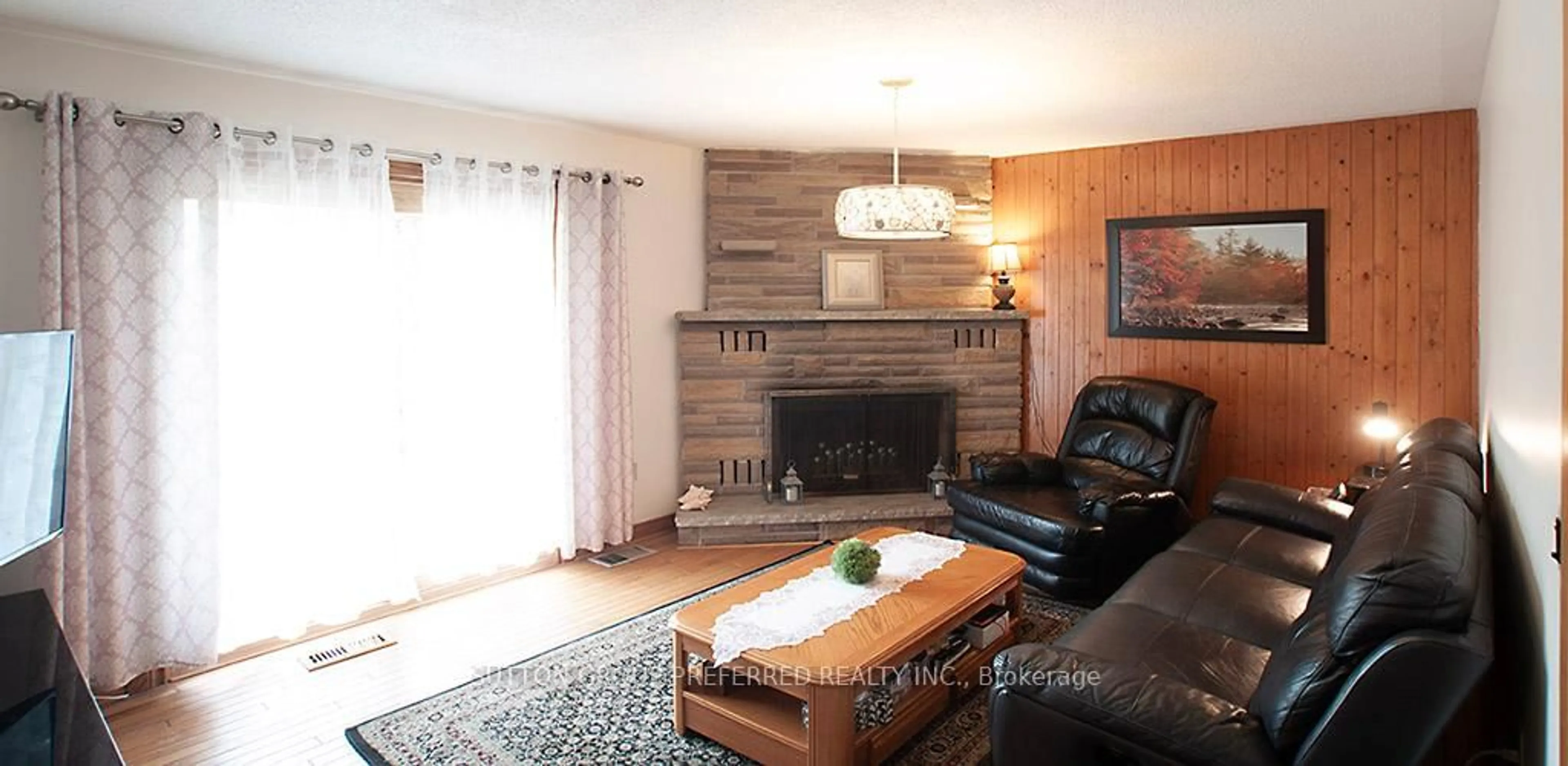 Living room with furniture, wood/laminate floor for 802 Phyllis St, London South Ontario N6J 2Z5