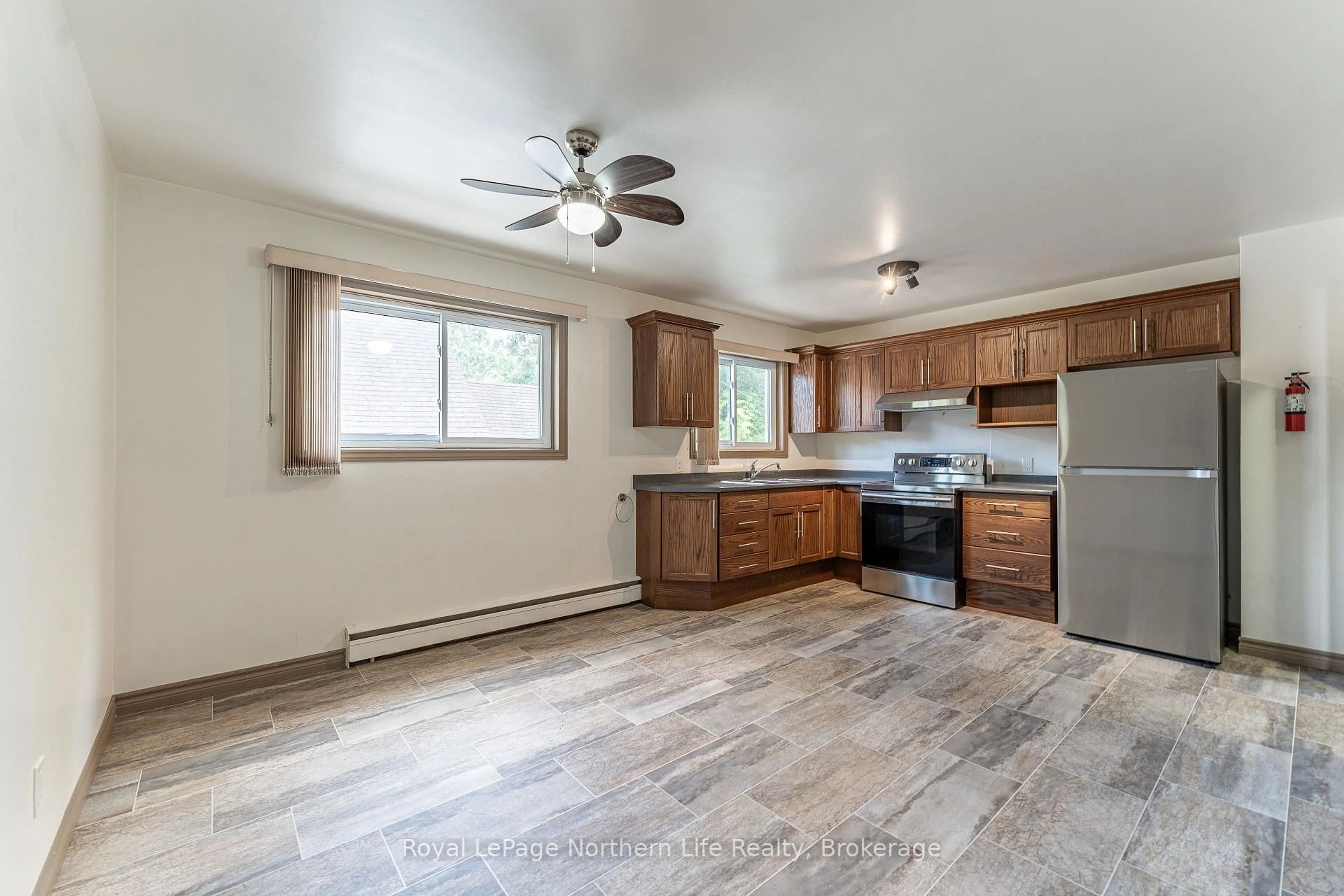 Open concept kitchen, wood/laminate floor for 745 Morin St, North Bay Ontario P1B 5S1