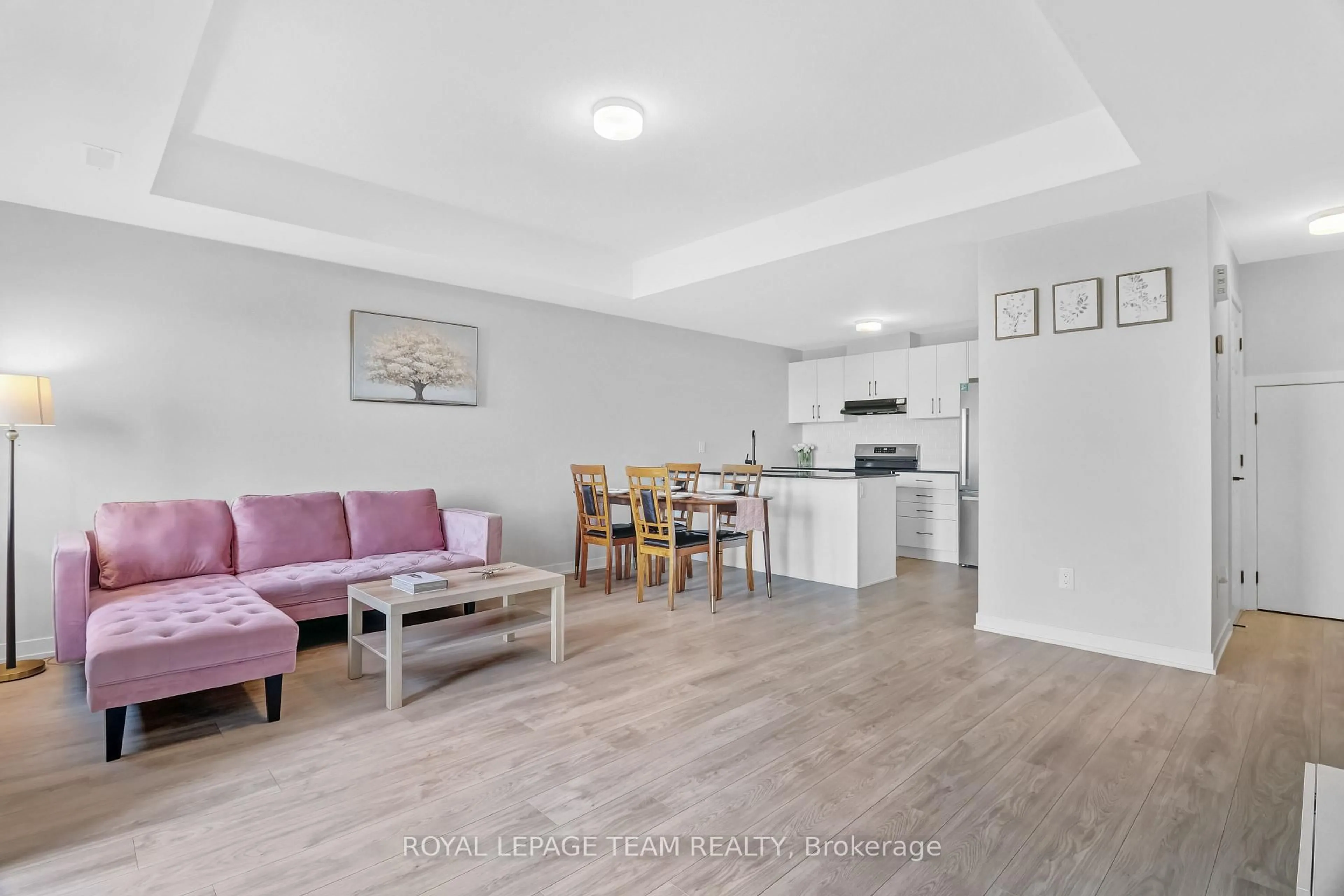 Living room with furniture, wood/laminate floor for 620 Parnian Private, Ottawa Ontario K2J 7K6