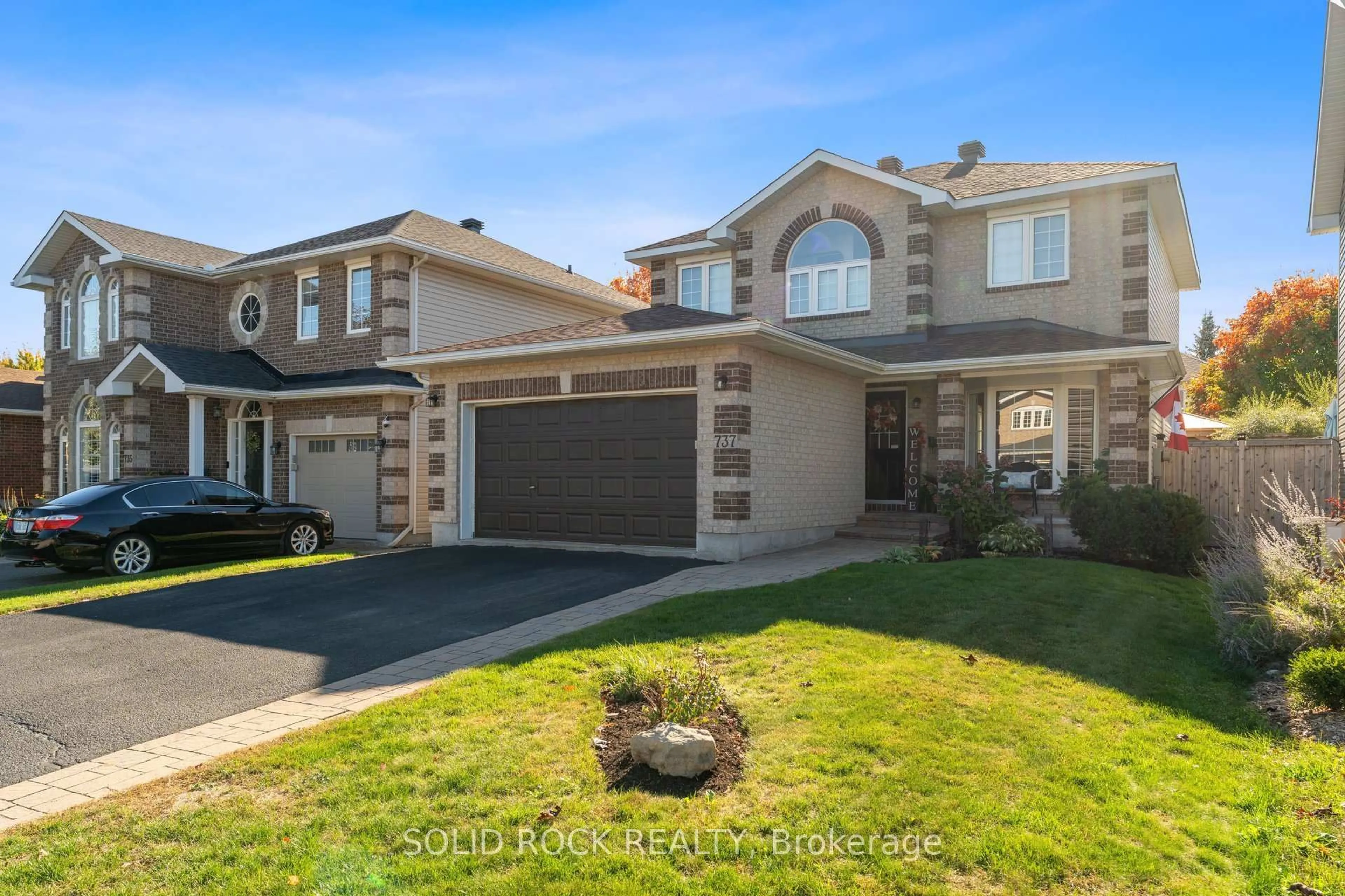 Home with brick exterior material, street for 737 Vermillion Dr, Ottawa Ontario K1V 1V9