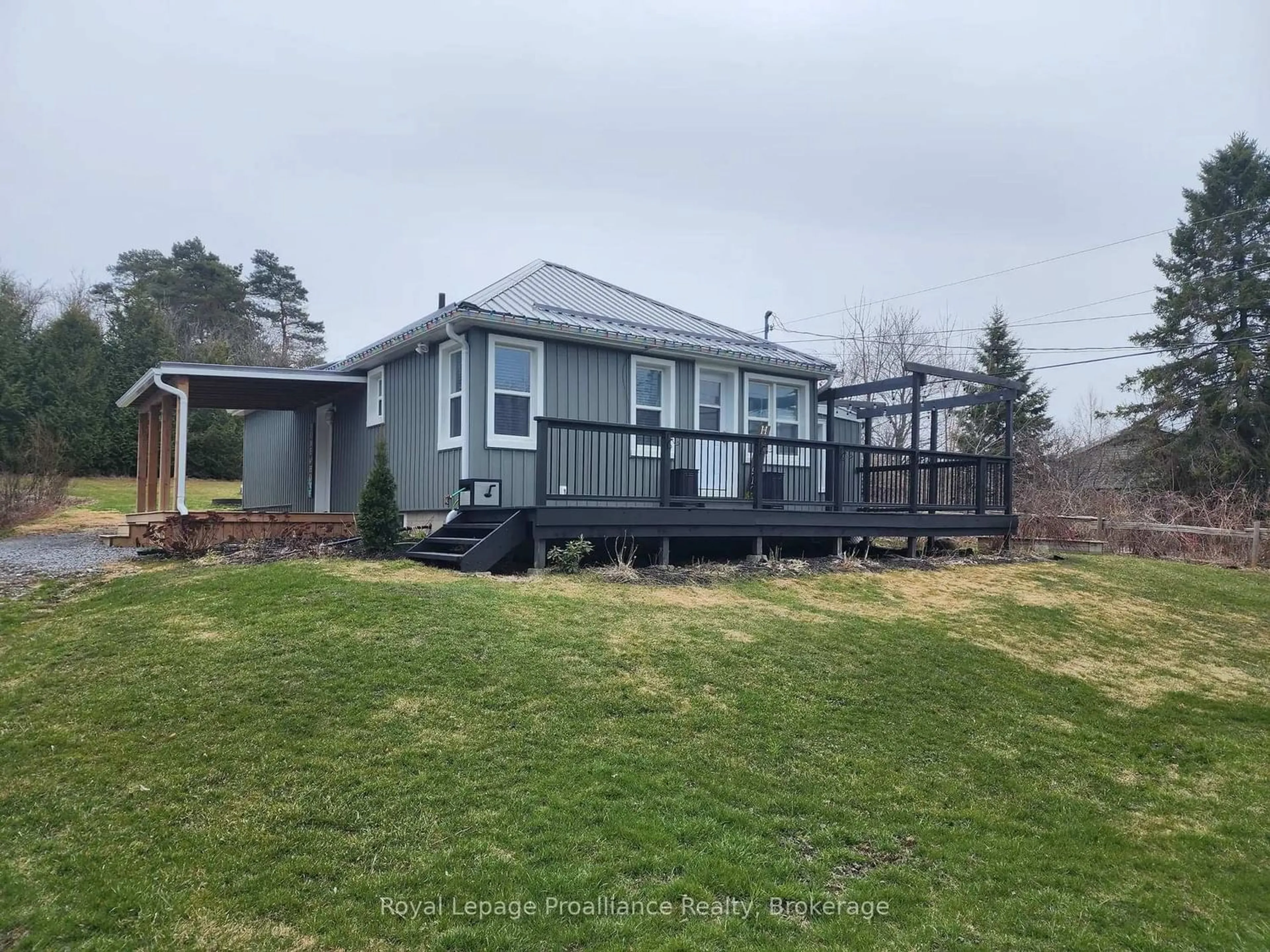 A pic from outside/outdoor area/front of a property/back of a property/a pic from drone, water/lake/river/ocean view for 2307 County Rd 3, Prince Edward County Ontario K0K 1L0
