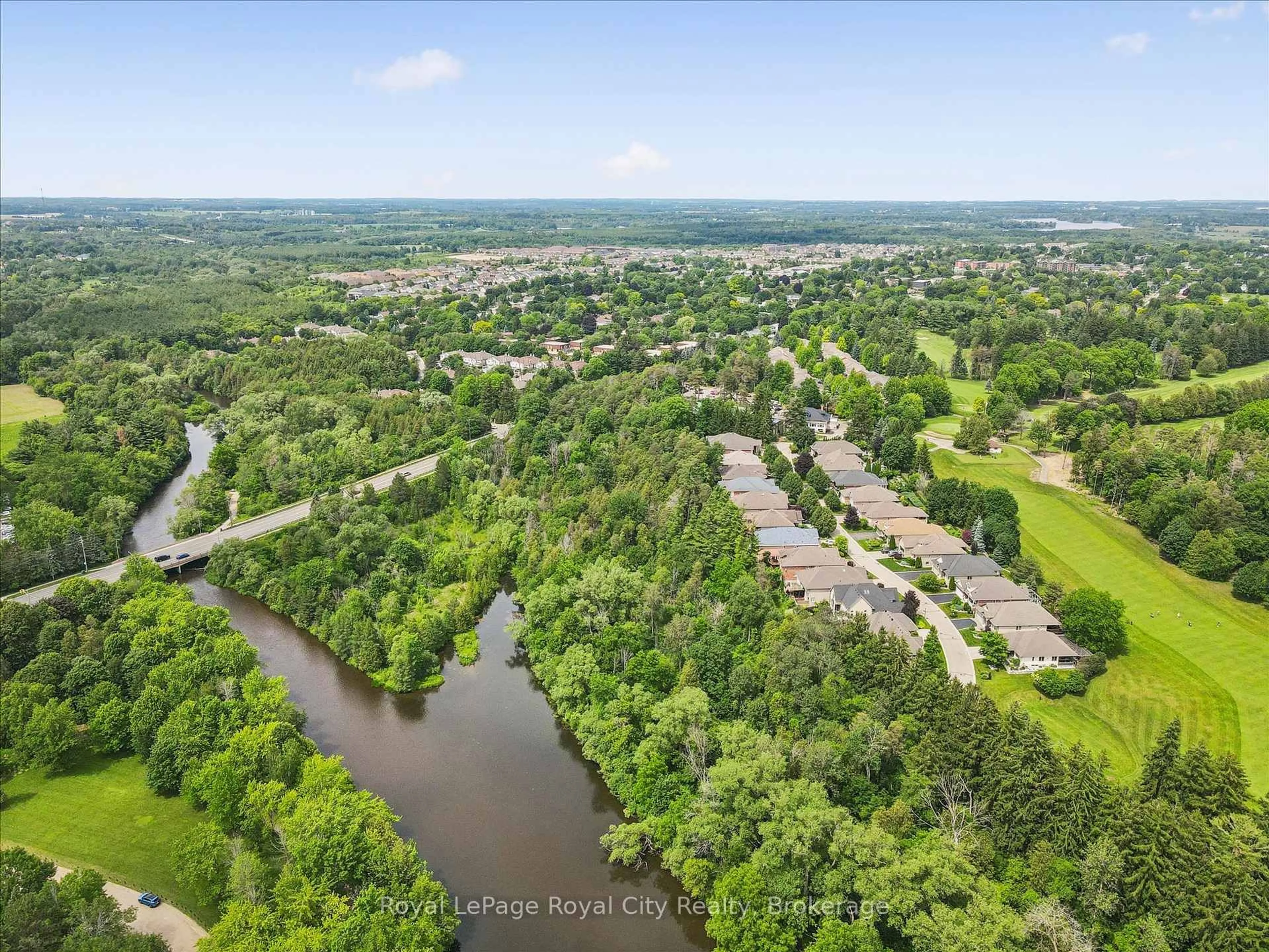 A pic from outside/outdoor area/front of a property/back of a property/a pic from drone, water/lake/river/ocean view for 17 Fairway Lane, Guelph Ontario N1E 7A8
