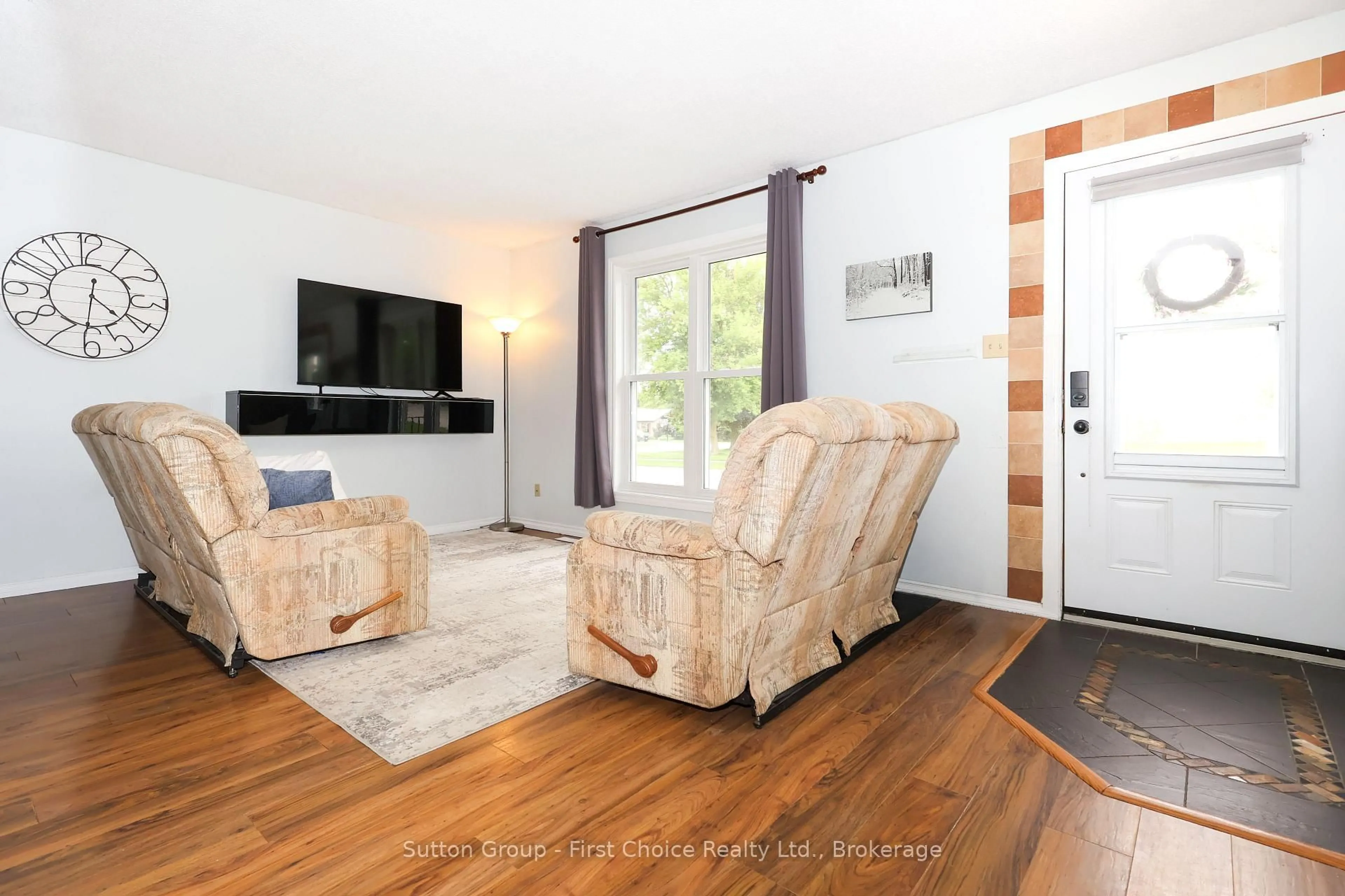 Living room with furniture, wood/laminate floor for 129 Mitchell Crt #B, West Perth Ontario N0K 1N0