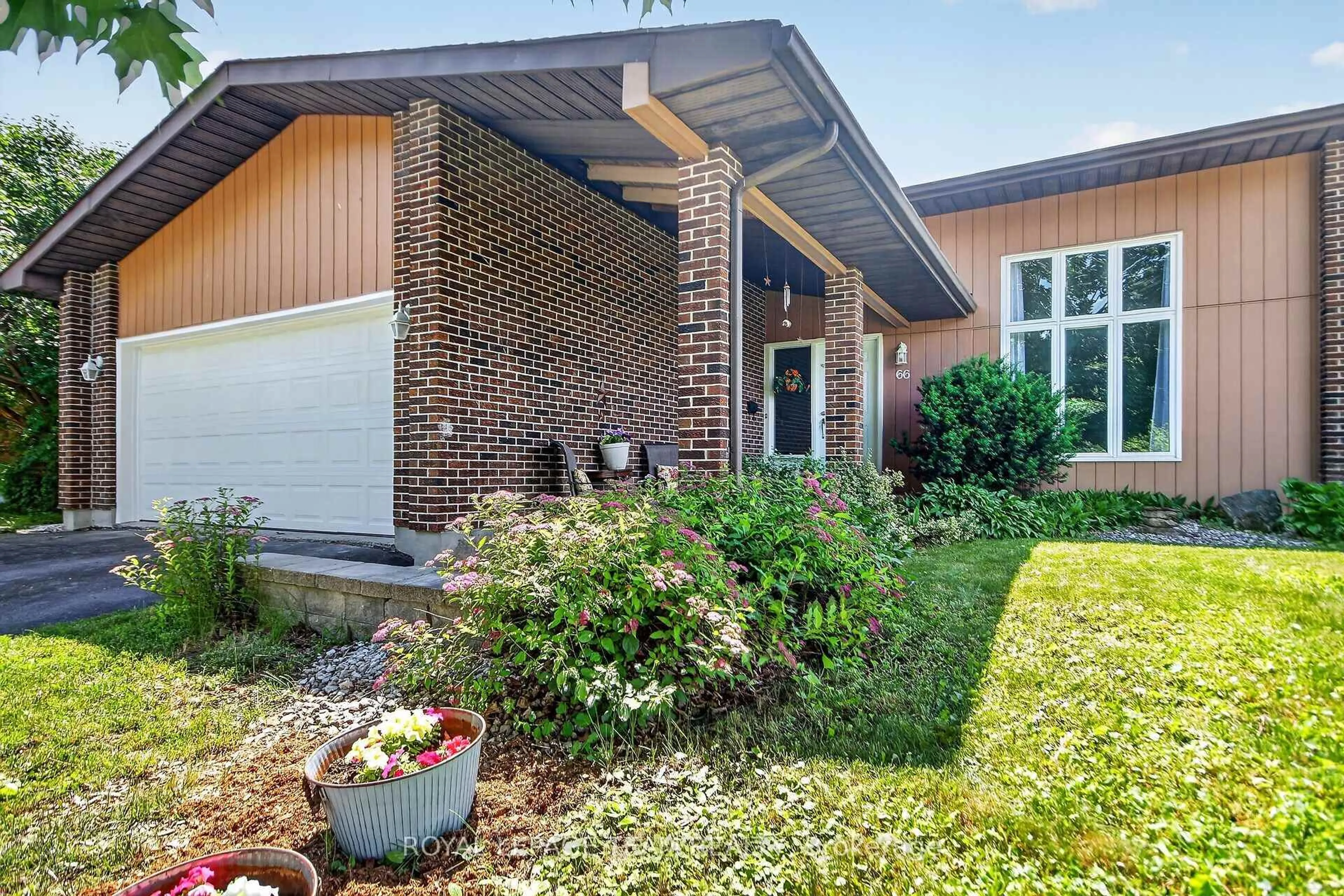 Home with brick exterior material, street for 66 Beaufort Dr, Kanata Ontario K2L 2G3