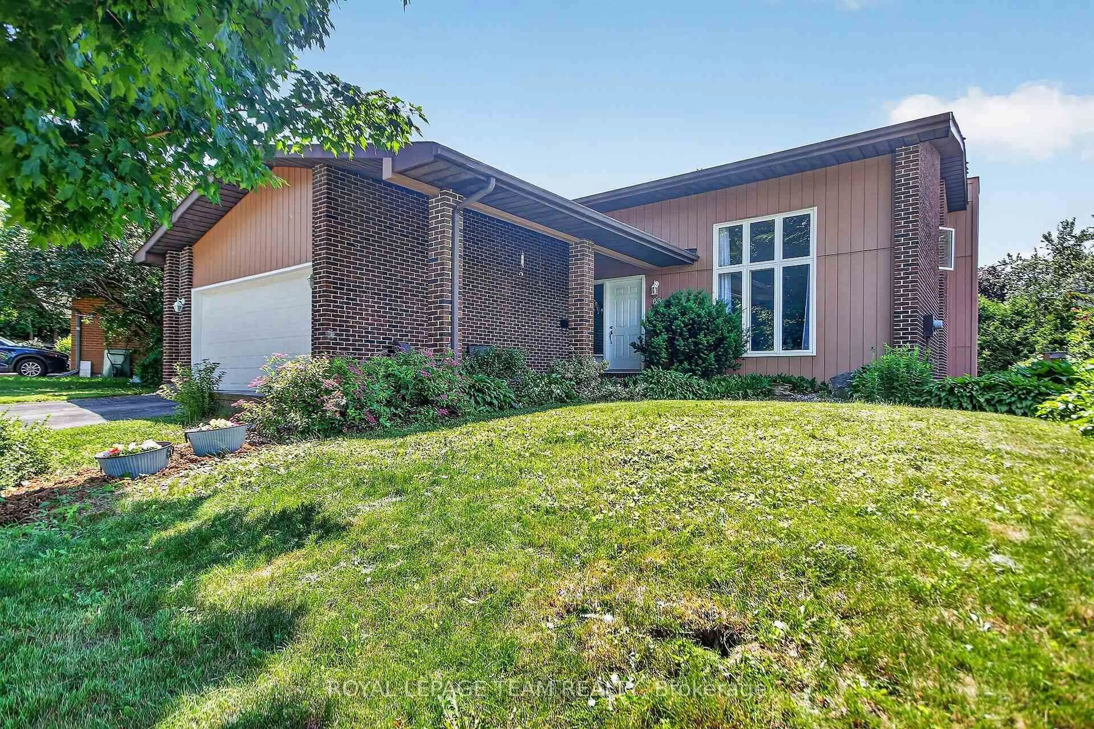Home with brick exterior material, street for 66 Beaufort Dr, Kanata Ontario K2L 2G3