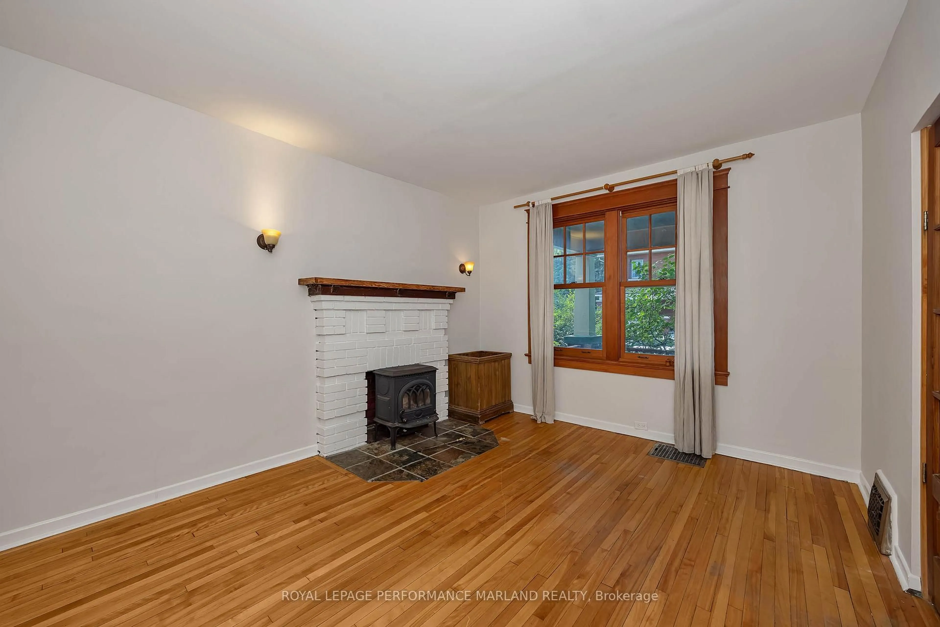 Living room with furniture, wood/laminate floor for 89 Fentiman Ave, Ottawa Ontario K1S 0T7