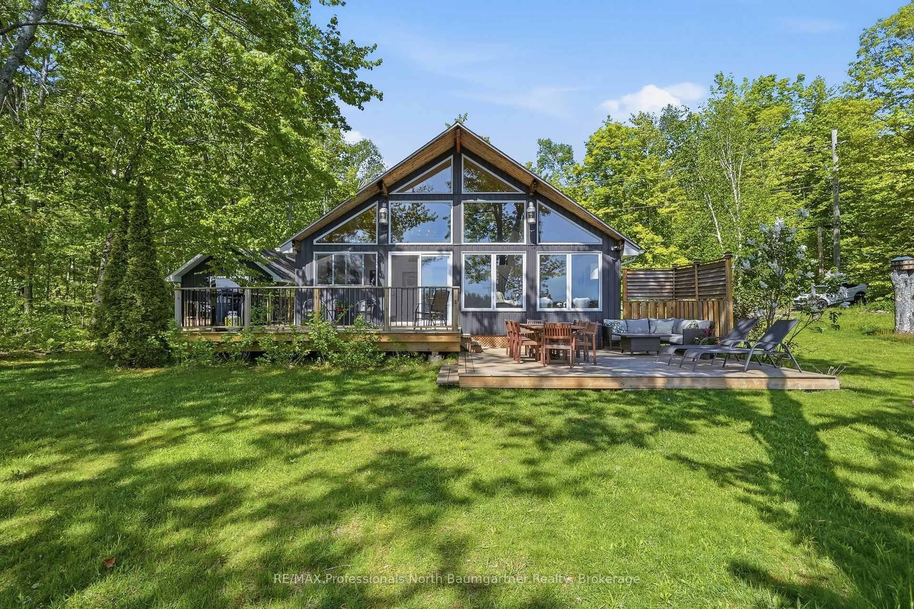 A pic from outside/outdoor area/front of a property/back of a property/a pic from drone, water/lake/river/ocean view for 1033 Poster Lane, Minden Hills Ontario K0M 2K0