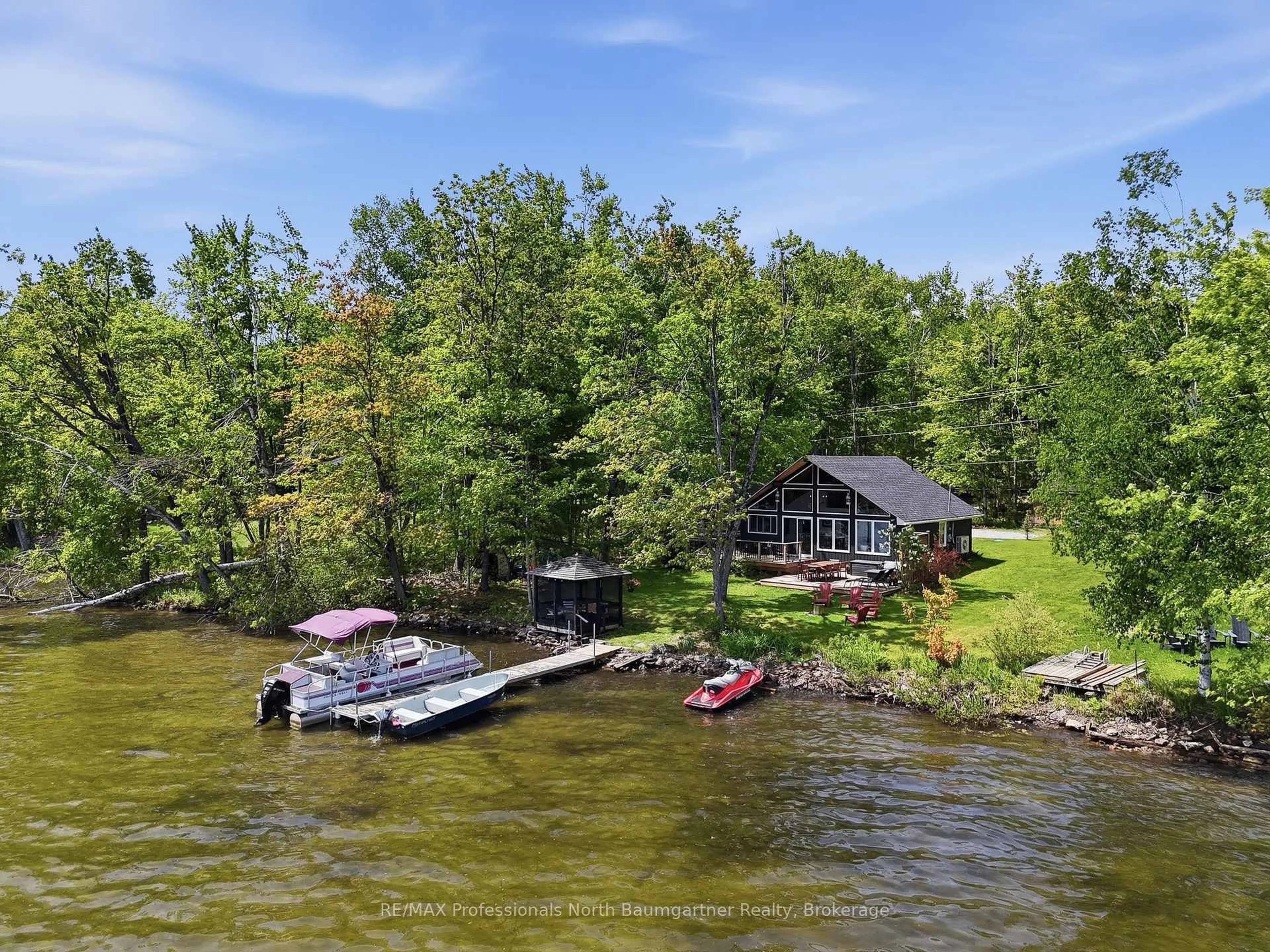 A pic from outside/outdoor area/front of a property/back of a property/a pic from drone, water/lake/river/ocean view for 1033 Poster Lane, Minden Hills Ontario K0M 2K0
