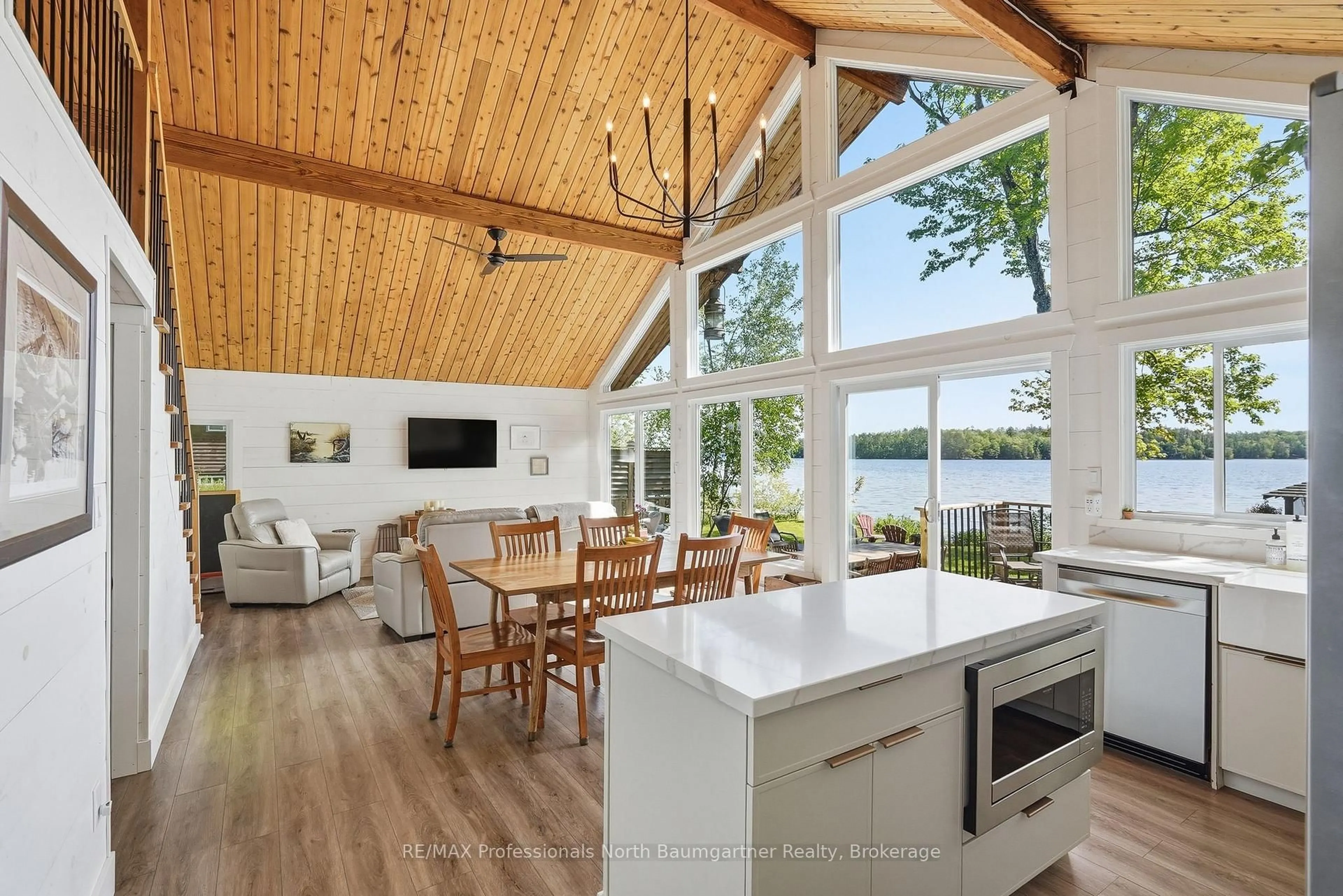 Open concept kitchen, wood/laminate floor for 1033 Poster Lane, Minden Hills Ontario K0M 2K0