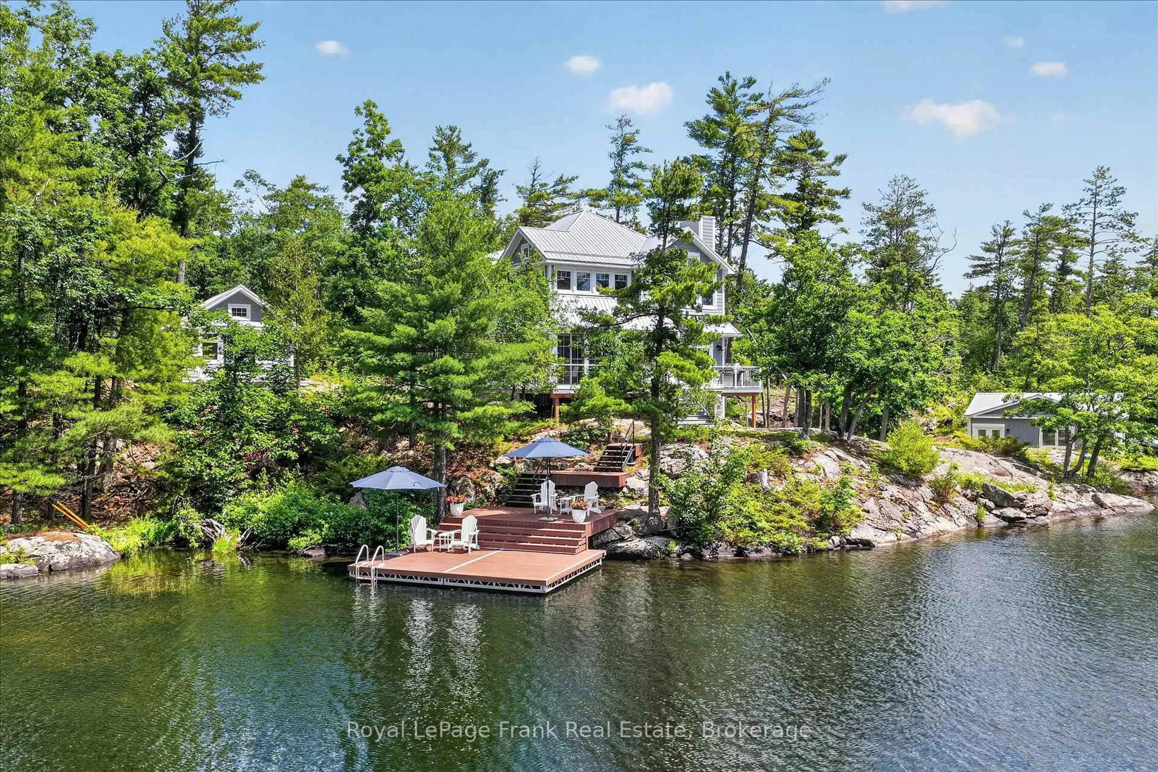 A pic from outside/outdoor area/front of a property/back of a property/a pic from drone, water/lake/river/ocean view for 1012 Island 35 Stoney Lake, Douro-Dummer Ontario K0L 2H0
