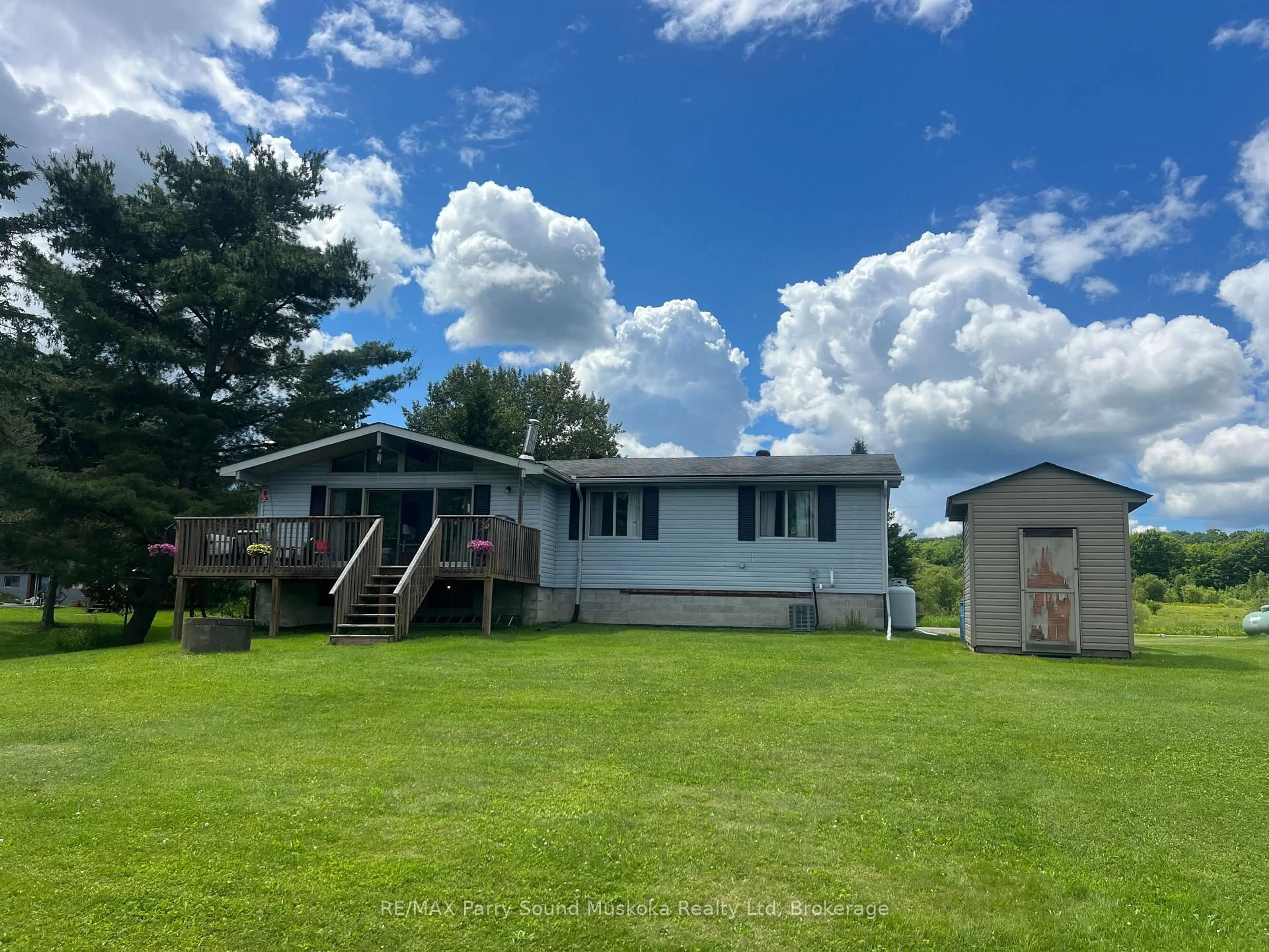 A pic from outside/outdoor area/front of a property/back of a property/a pic from drone, water/lake/river/ocean view for 15 Dockside Dr, McKellar Ontario P0G 1C0