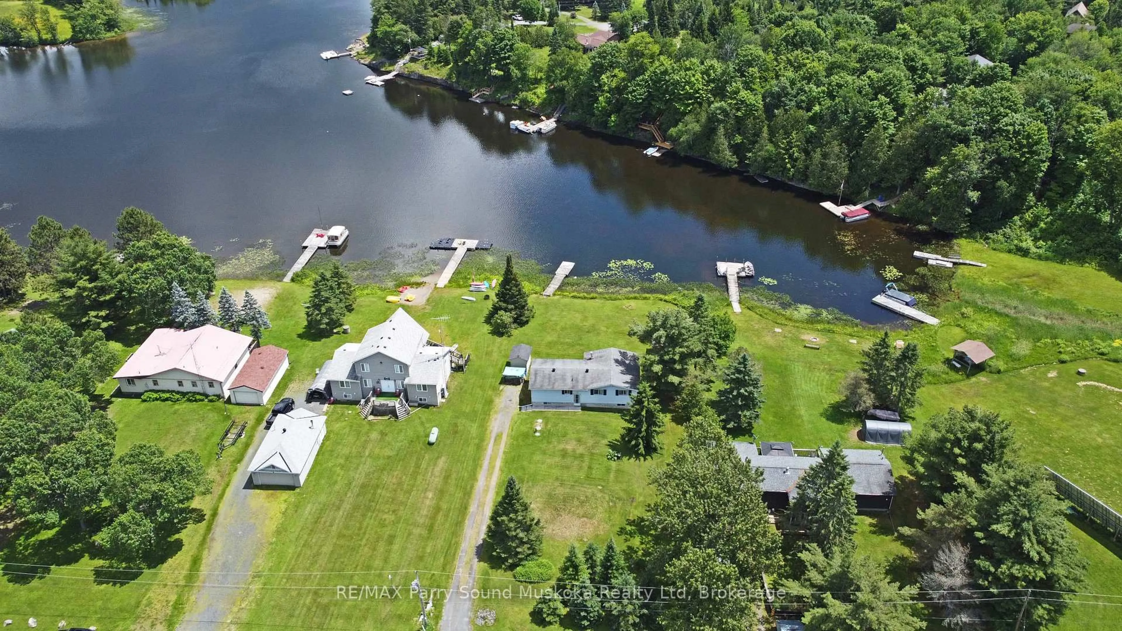 A pic from outside/outdoor area/front of a property/back of a property/a pic from drone, water/lake/river/ocean view for 15 Dockside Dr, McKellar Ontario P0G 1C0