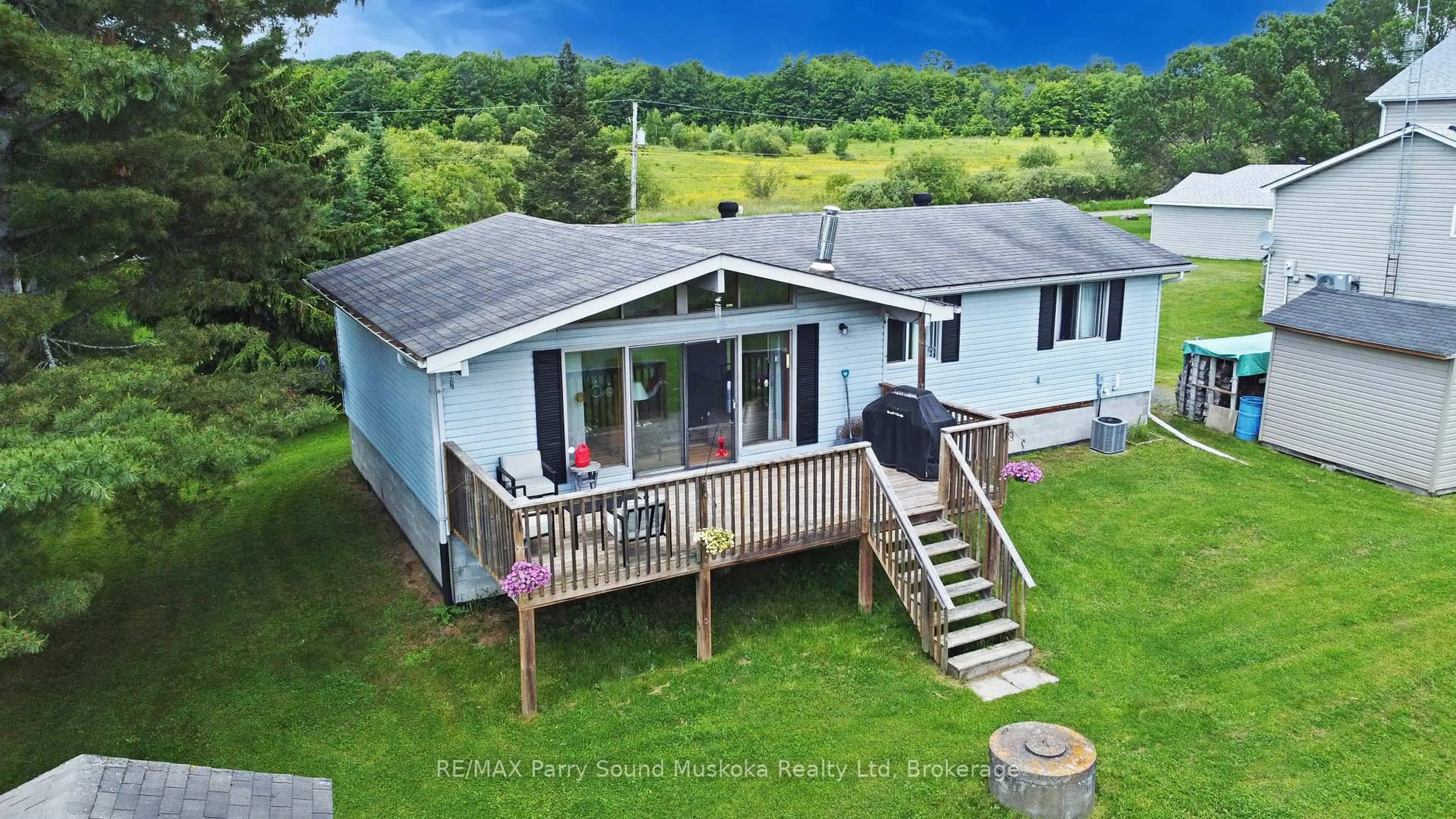 A pic from outside/outdoor area/front of a property/back of a property/a pic from drone, water/lake/river/ocean view for 15 Dockside Dr, McKellar Ontario P0G 1C0