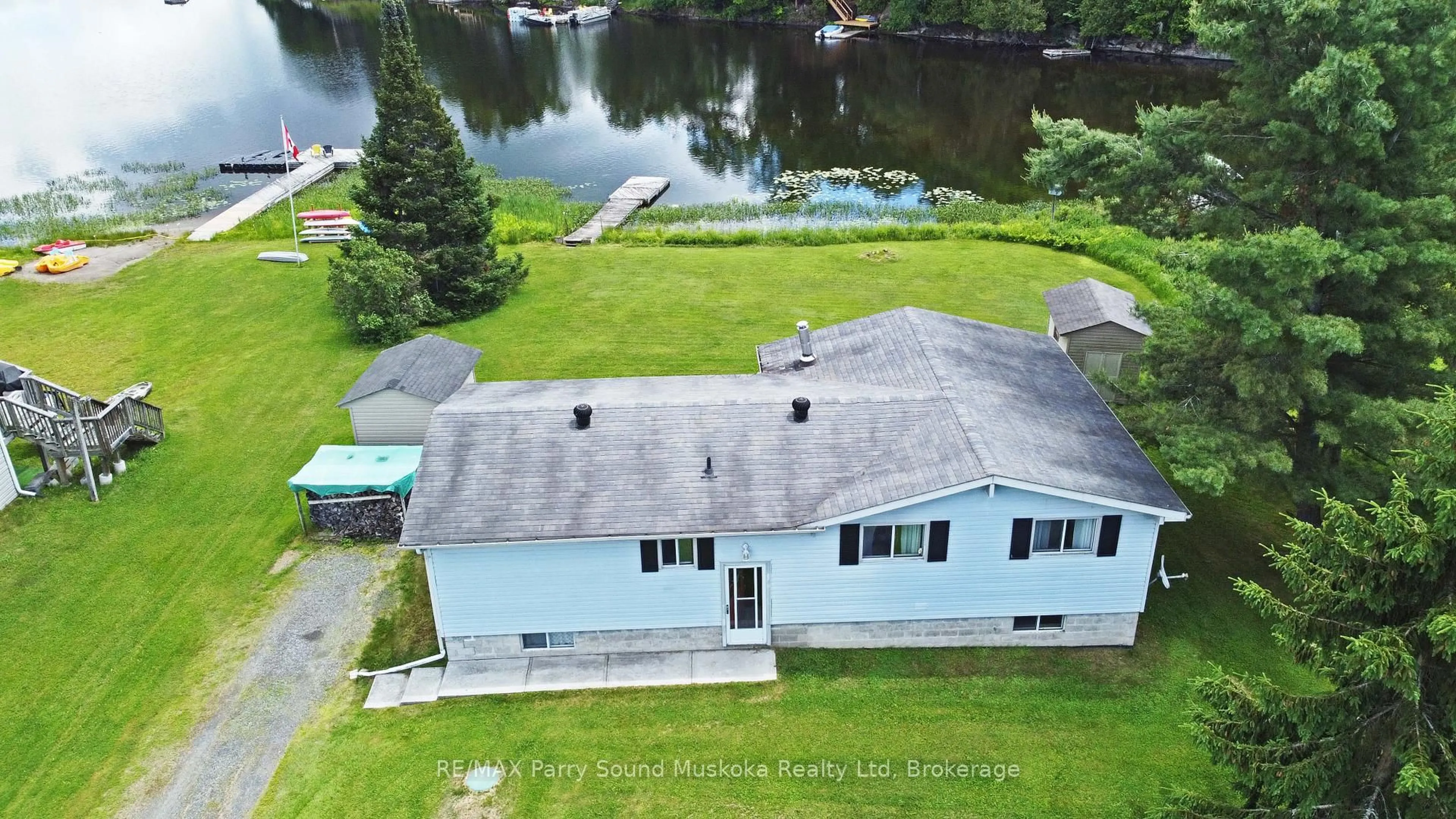 A pic from outside/outdoor area/front of a property/back of a property/a pic from drone, water/lake/river/ocean view for 15 Dockside Dr, McKellar Ontario P0G 1C0