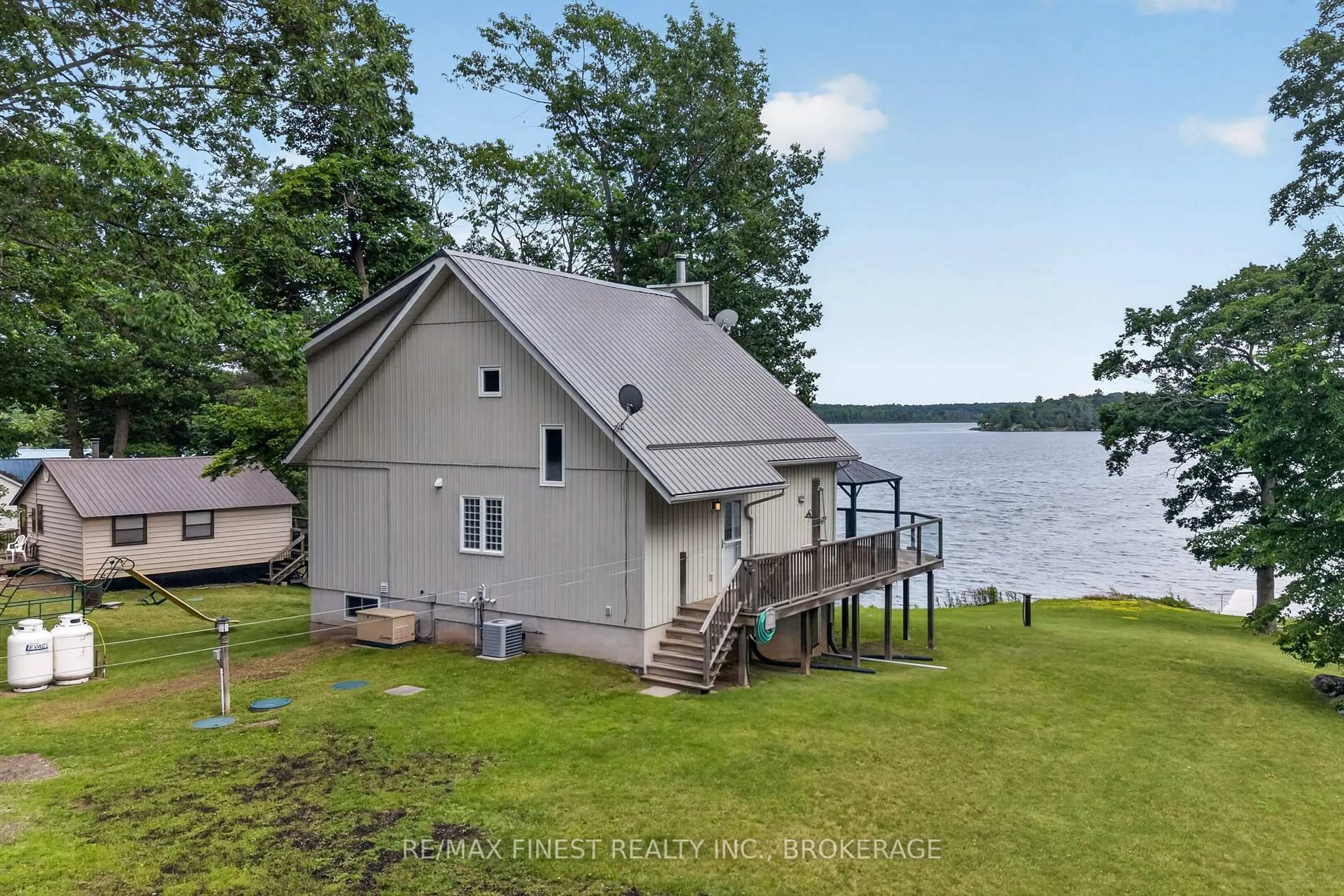A pic from outside/outdoor area/front of a property/back of a property/a pic from drone, water/lake/river/ocean view for 3459 Buck Point Lane, Inverary Ontario K0H 1X0