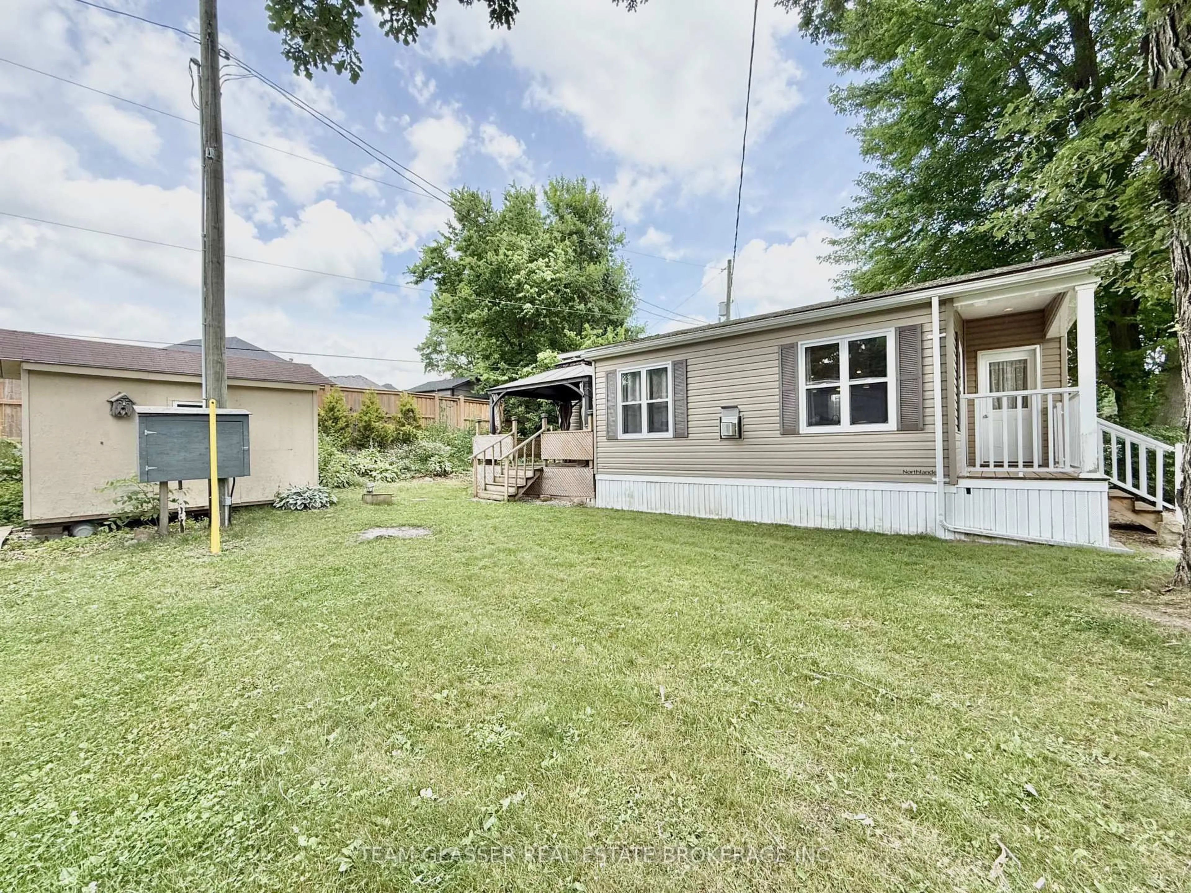 A pic from outside/outdoor area/front of a property/back of a property/a pic from drone, street for 24749 Park St #2, Strathroy-Caradoc Ontario N7G 3H5