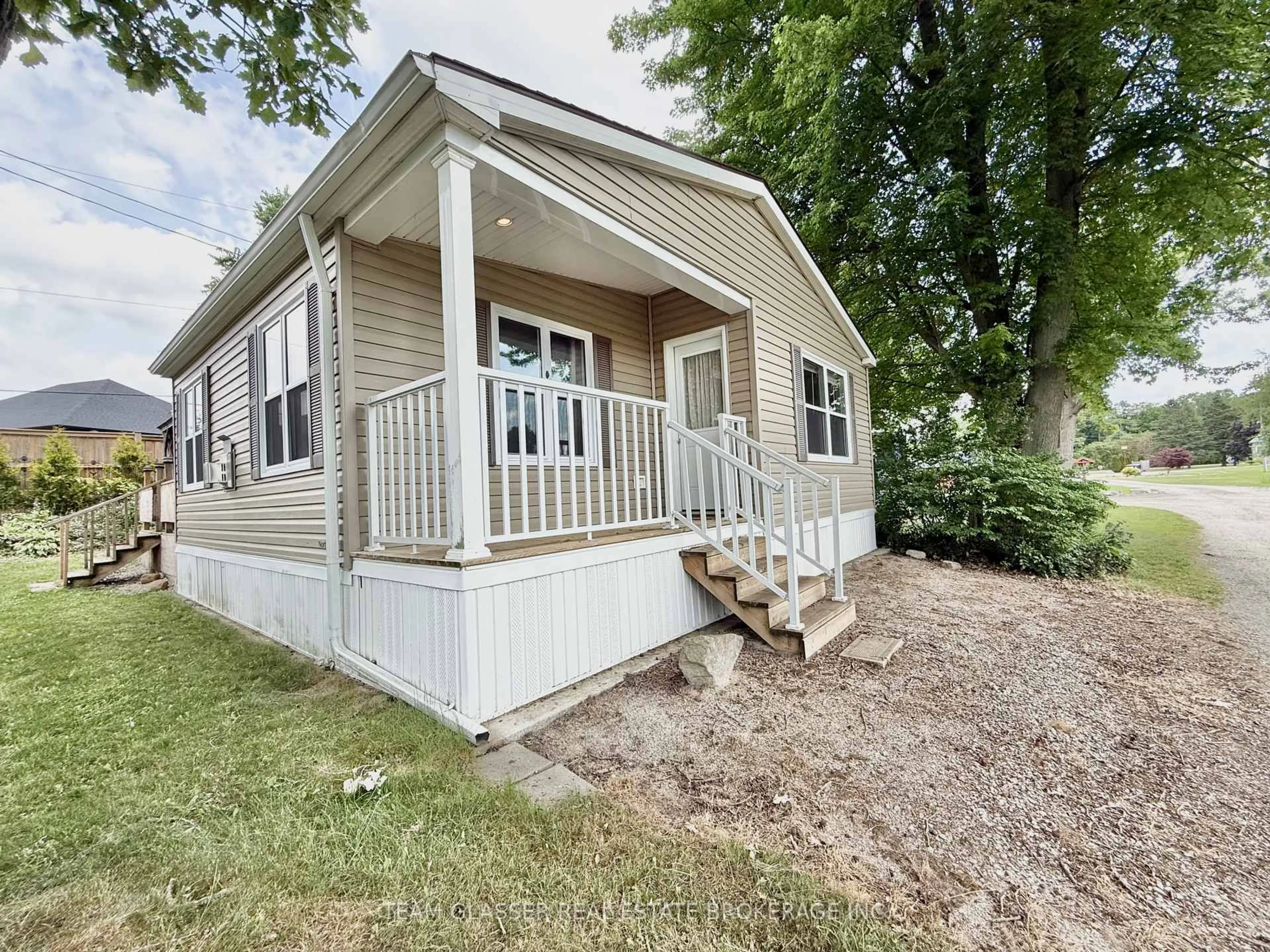Home with vinyl exterior material, street for 24749 Park St #2, Strathroy-Caradoc Ontario N7G 3H5
