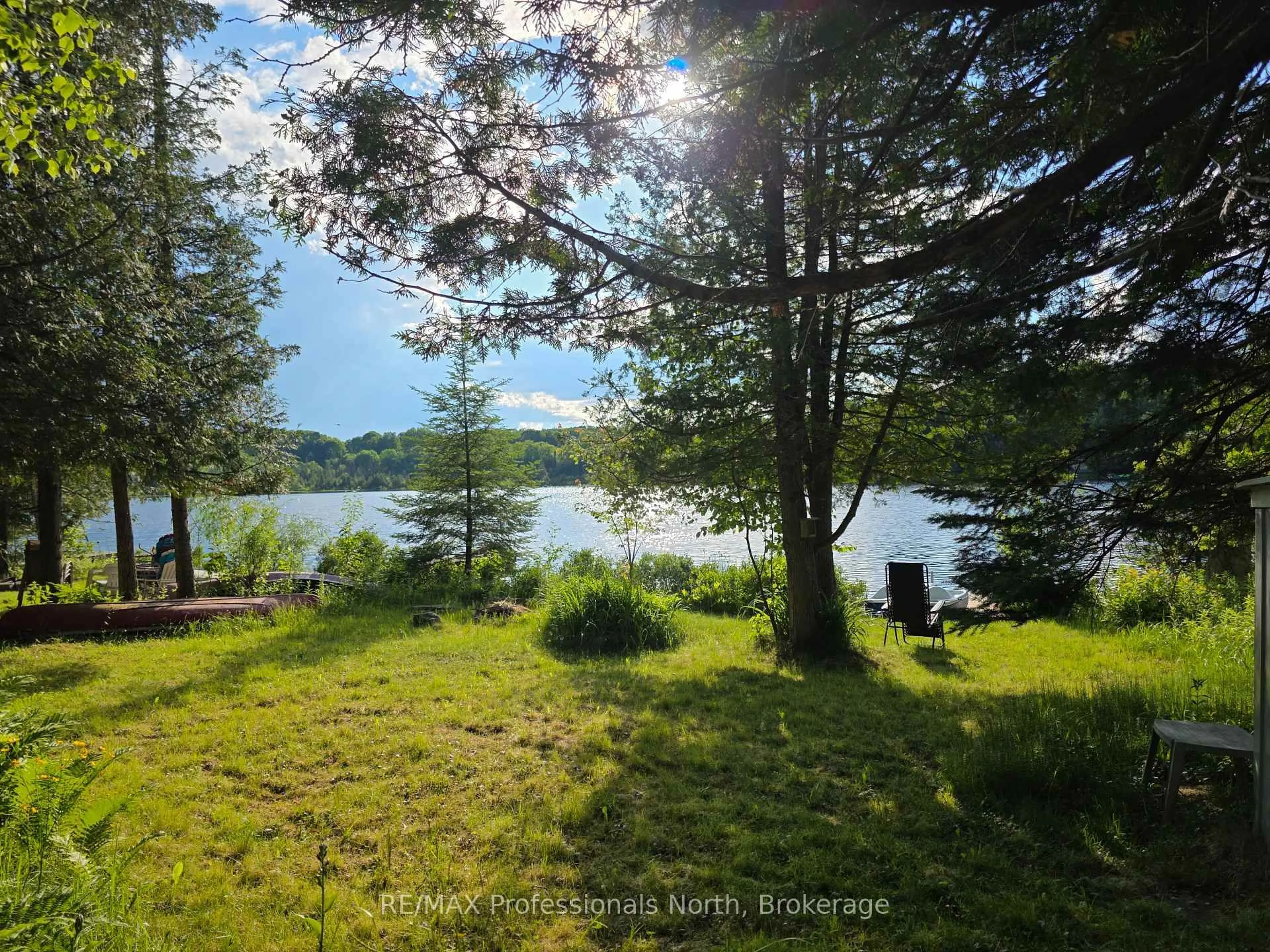 A pic from outside/outdoor area/front of a property/back of a property/a pic from drone, water/lake/river/ocean view for 1131 Sharon Lake Dr, Minden Hills Ontario K0M 2K0