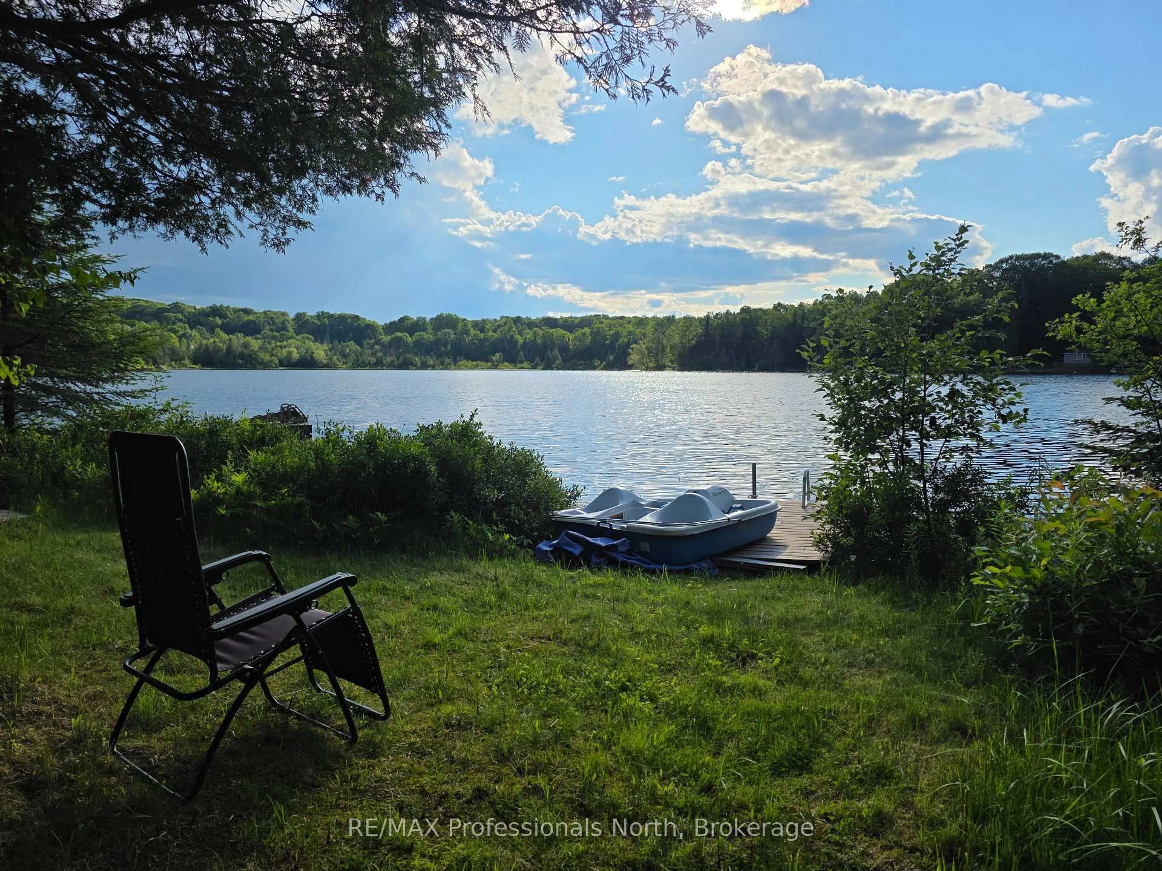 A pic from outside/outdoor area/front of a property/back of a property/a pic from drone, water/lake/river/ocean view for 1131 Sharon Lake Dr, Minden Hills Ontario K0M 2K0