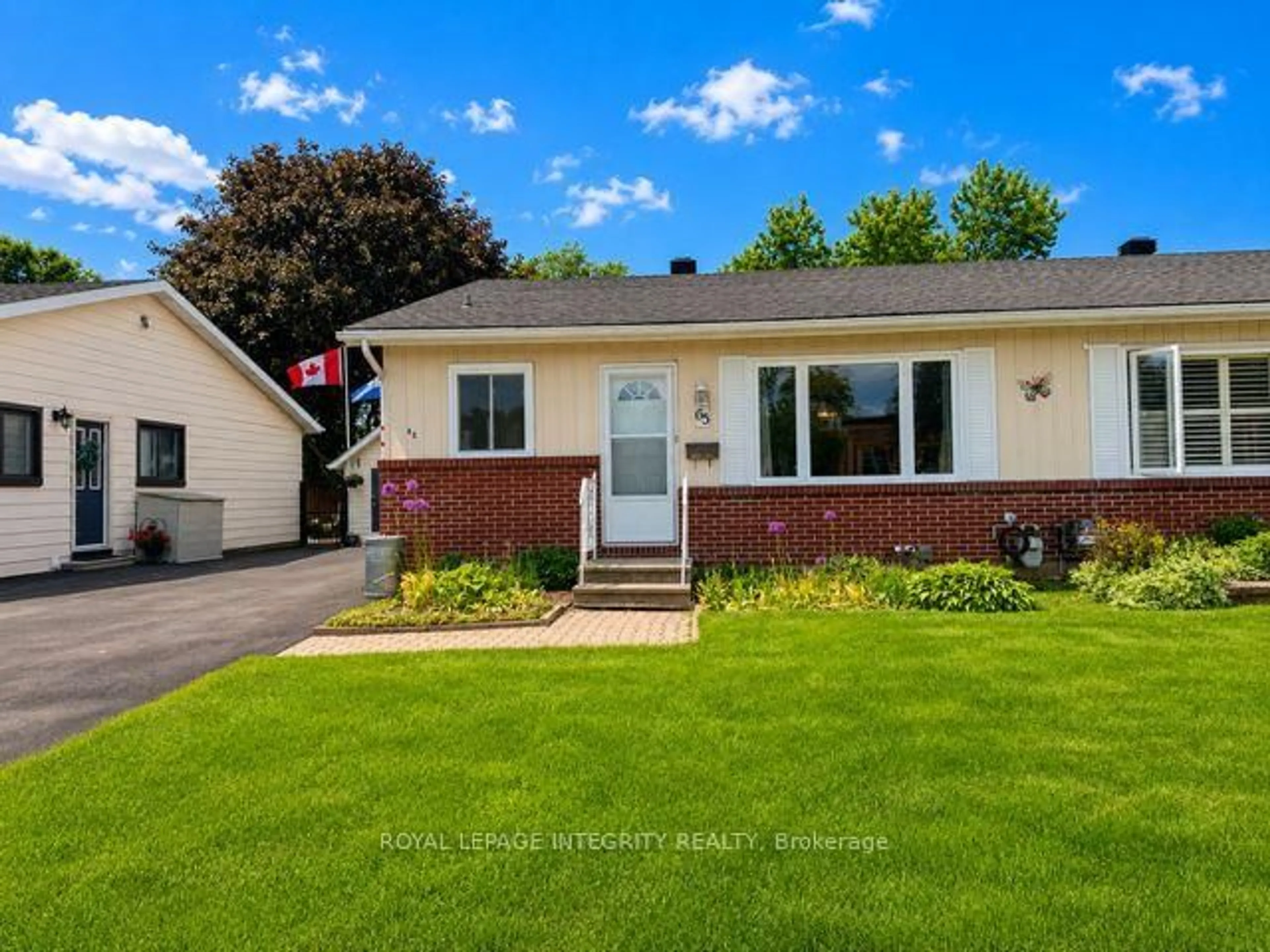 Home with vinyl exterior material, street for 65 Rothesay Dr, Kanata Ontario K2L 1N6