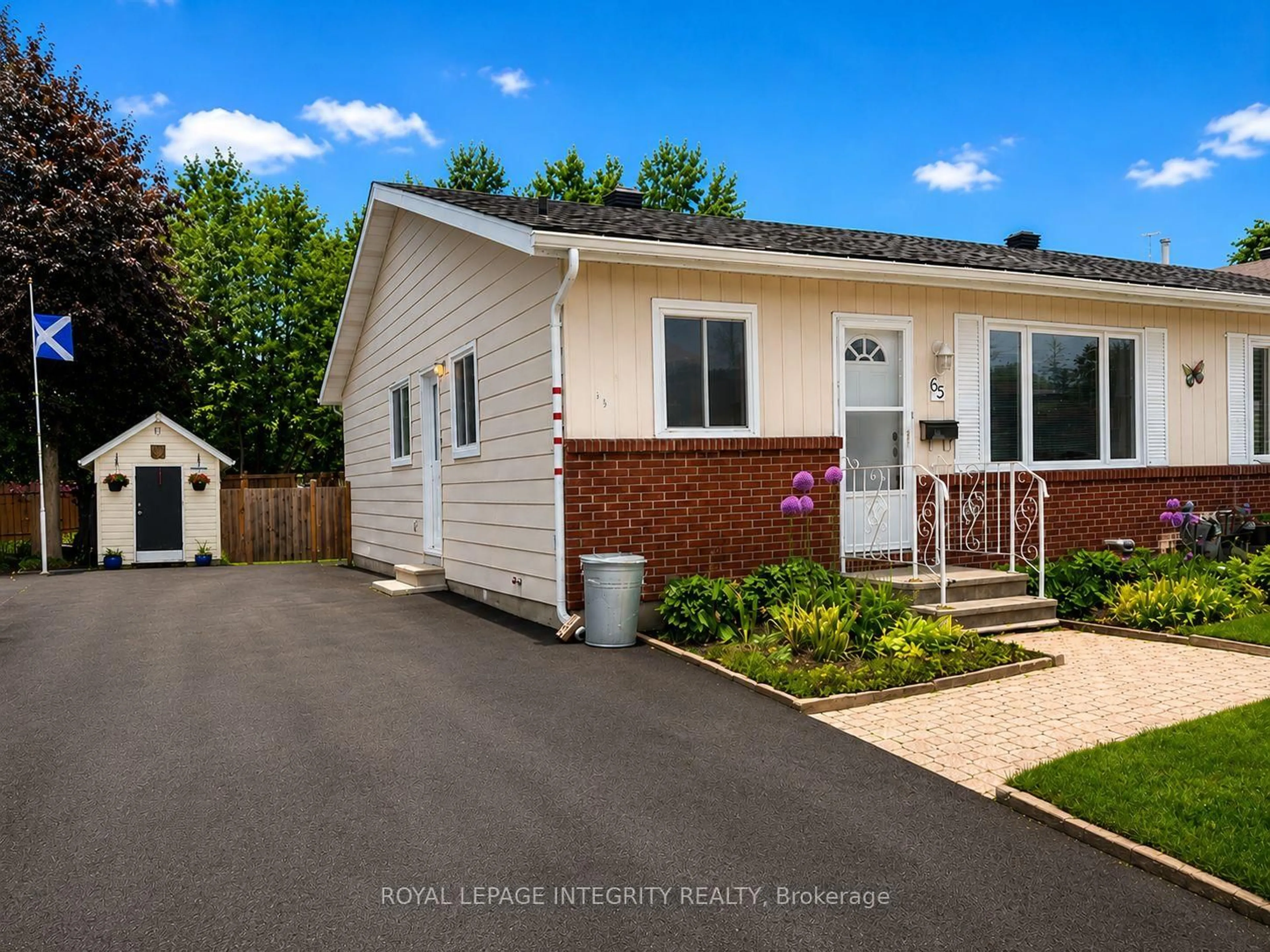 Home with vinyl exterior material, street for 65 Rothesay Dr, Kanata Ontario K2L 1N6
