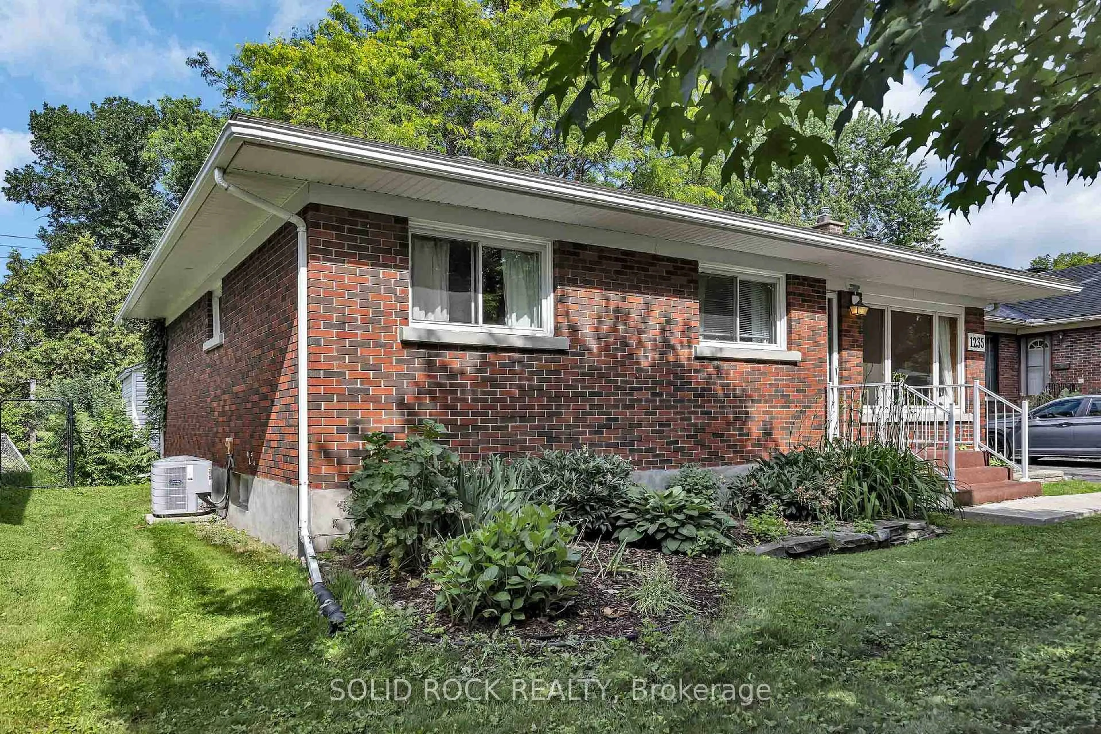 Home with brick exterior material, street for 1235 Major St, Ottawa Ontario K2C 2S3