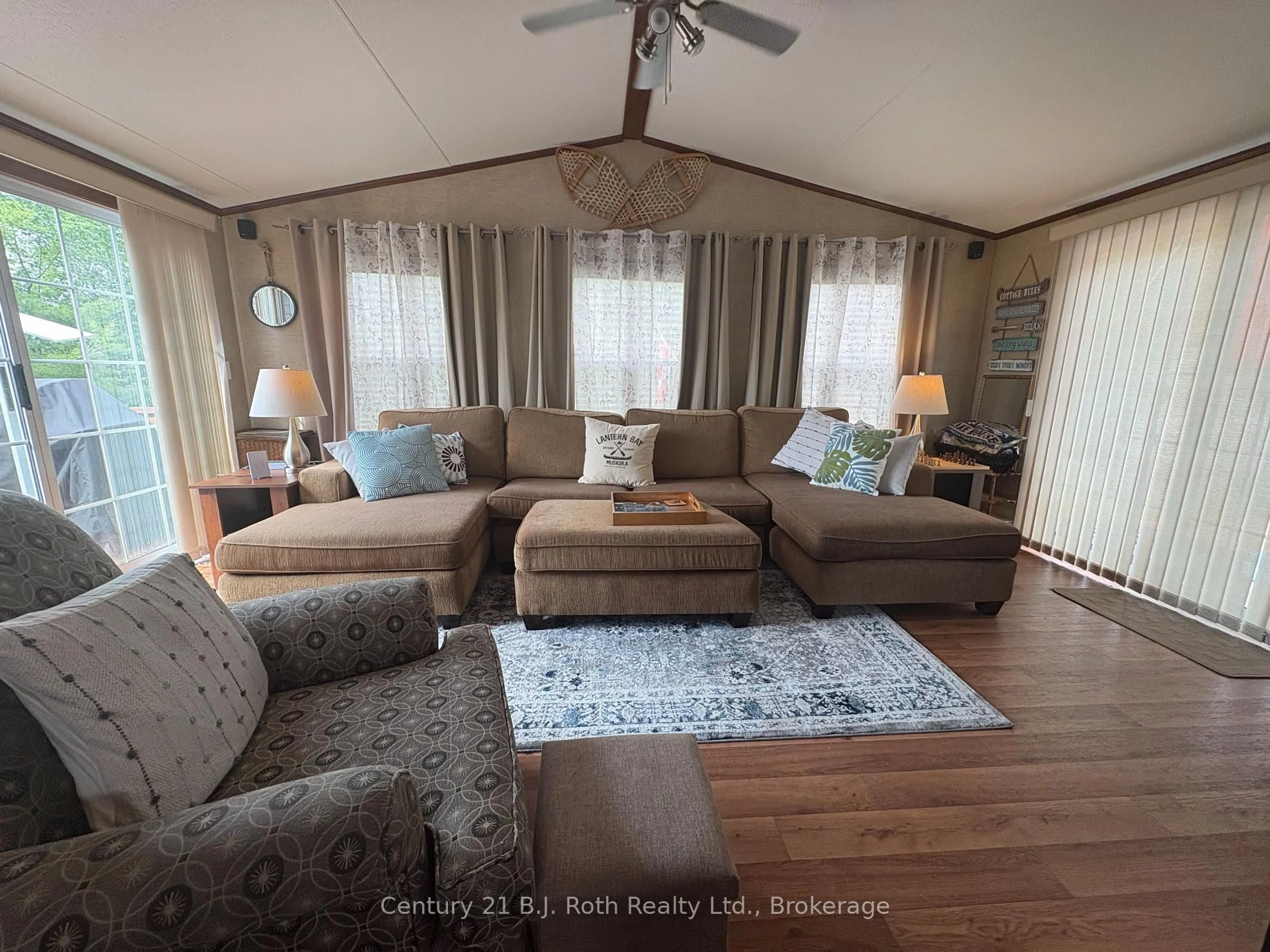 Living room with furniture, wood/laminate floor for 1336 Morrison Lake Rd #24 MPLRDG, Gravenhurst Ontario P0E 1G0