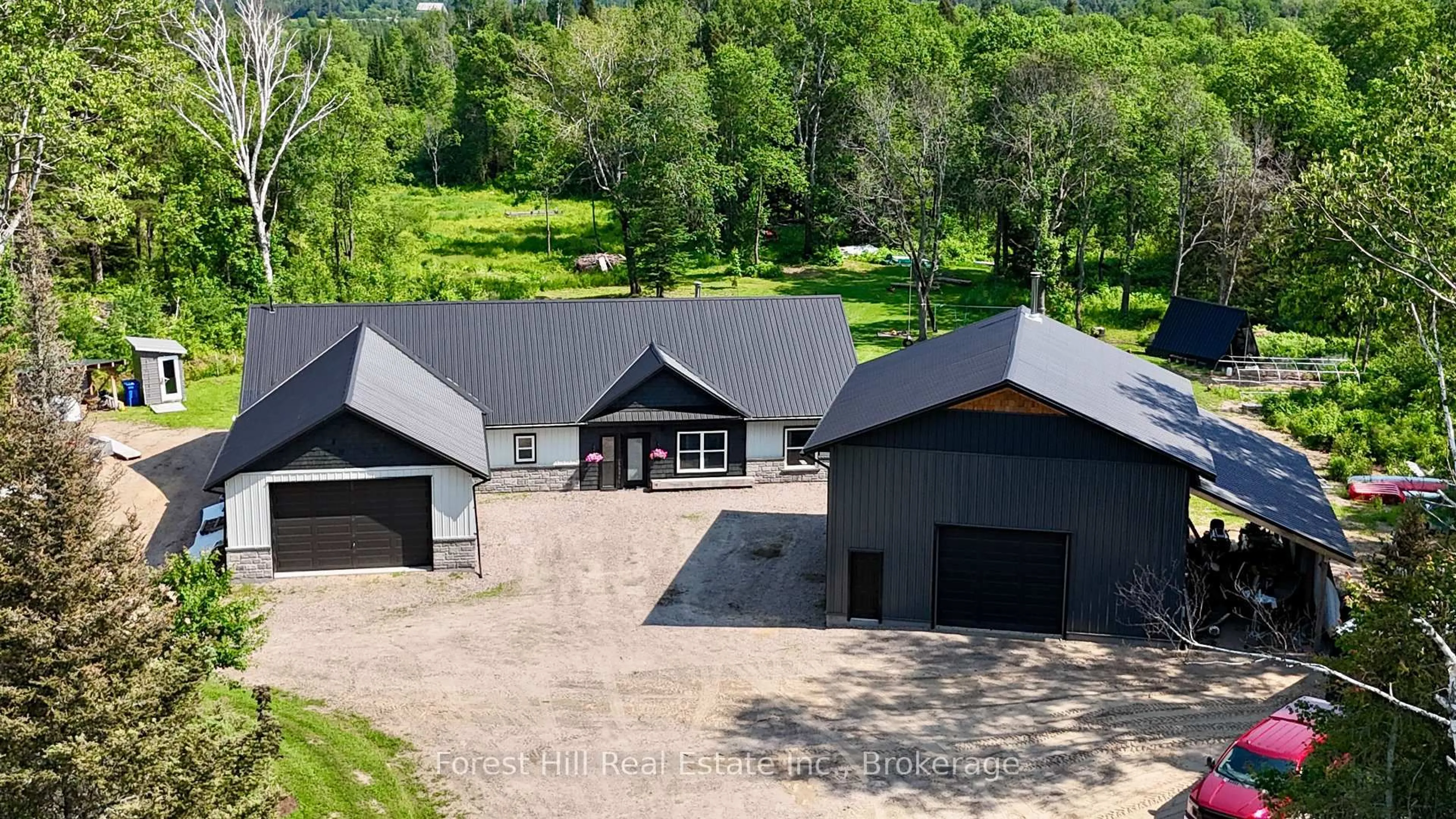 A pic from outside/outdoor area/front of a property/back of a property/a pic from drone, unknown for 107 Hunt Line, Powassan Ontario P0H 1Z0