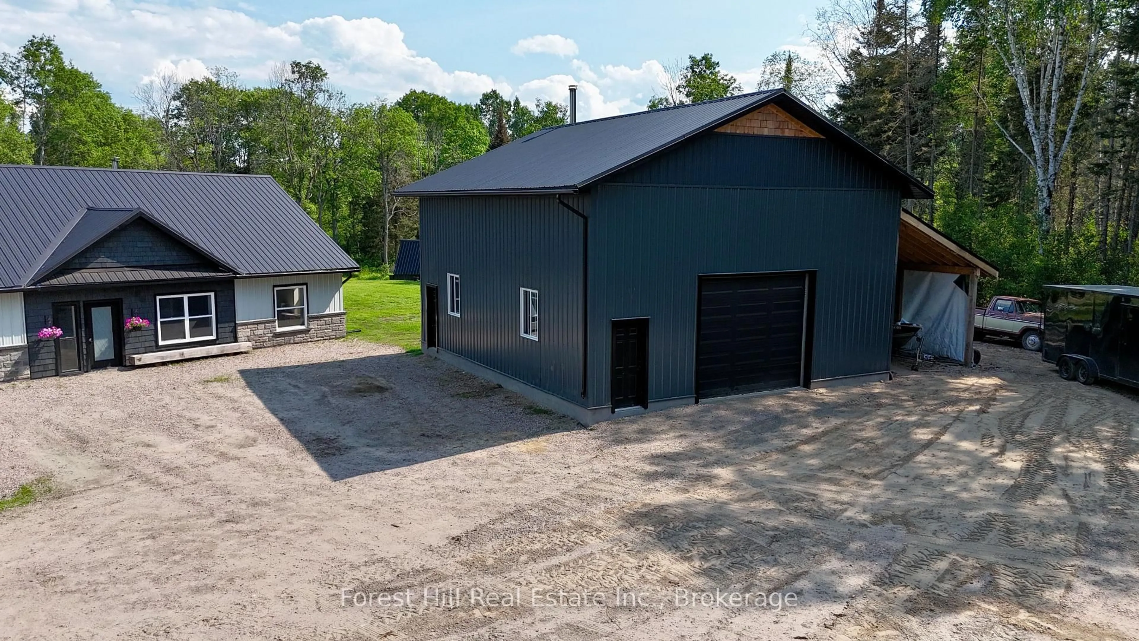 A pic from outside/outdoor area/front of a property/back of a property/a pic from drone, building for 107 Hunt Line, Powassan Ontario P0H 1Z0
