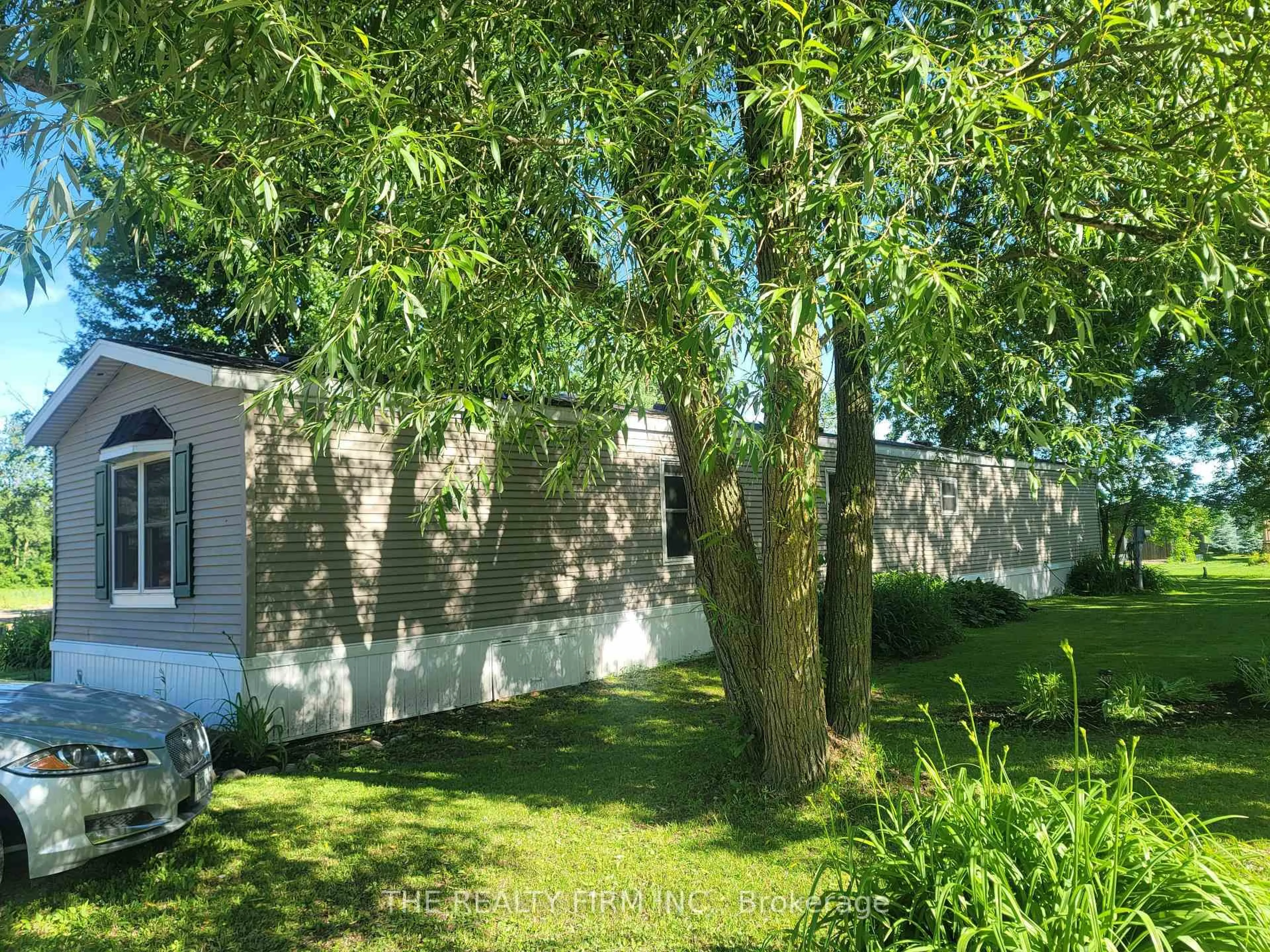 A pic from outside/outdoor area/front of a property/back of a property/a pic from drone, forest/trees view for 75049 Hensall Rd #18, Huron East Ontario N0K 1W0