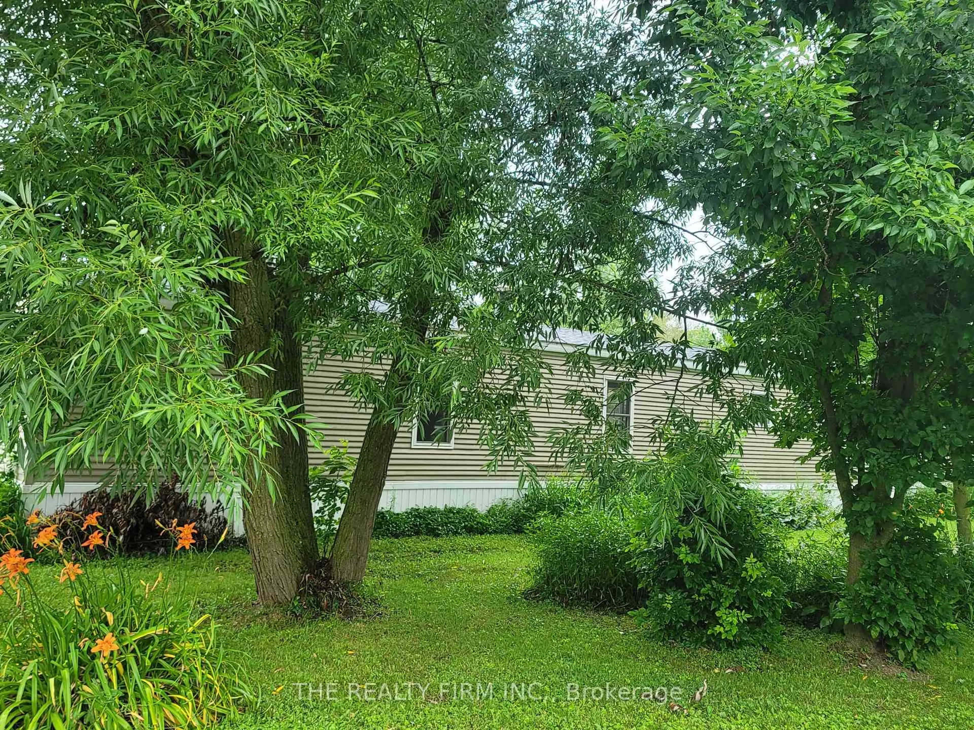 A pic from outside/outdoor area/front of a property/back of a property/a pic from drone, forest/trees view for 75049 Hensall Rd #18, Huron East Ontario N0K 1W0