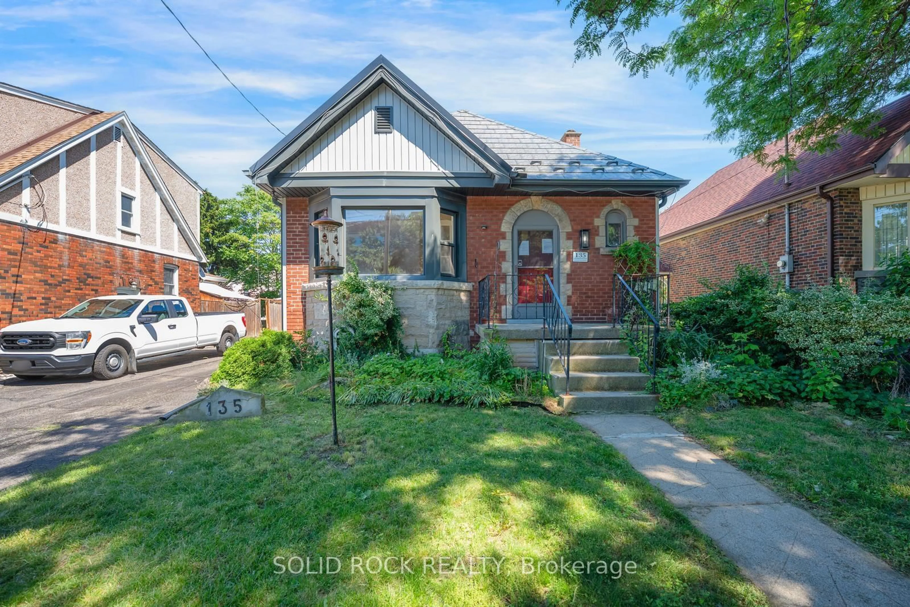 Home with brick exterior material, street for 135 Wexford Ave, Hamilton Ontario L8K 2N9