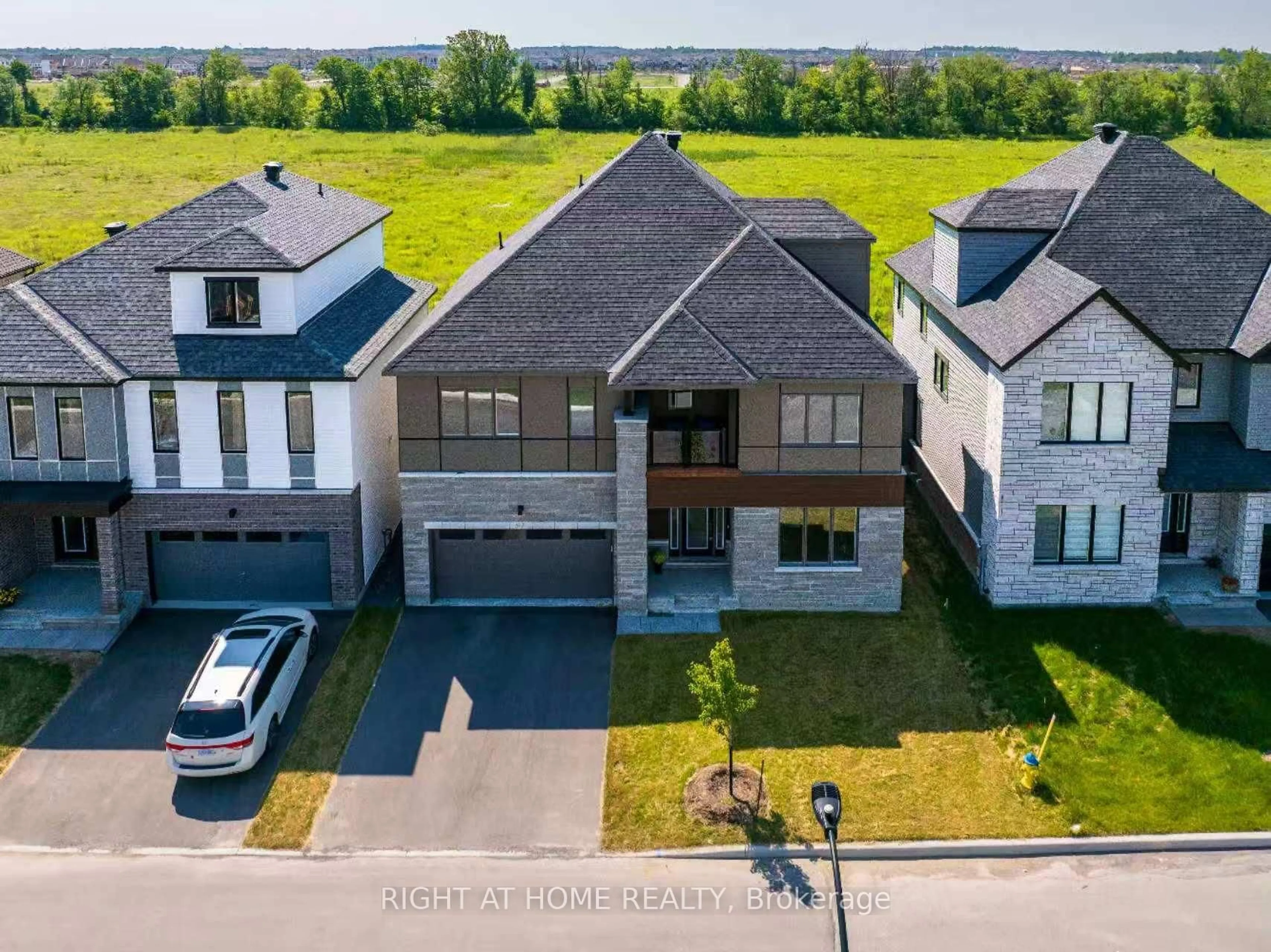 A pic from outside/outdoor area/front of a property/back of a property/a pic from drone, street for 517 Elation Hts, Ottawa Ontario K2J 4J4