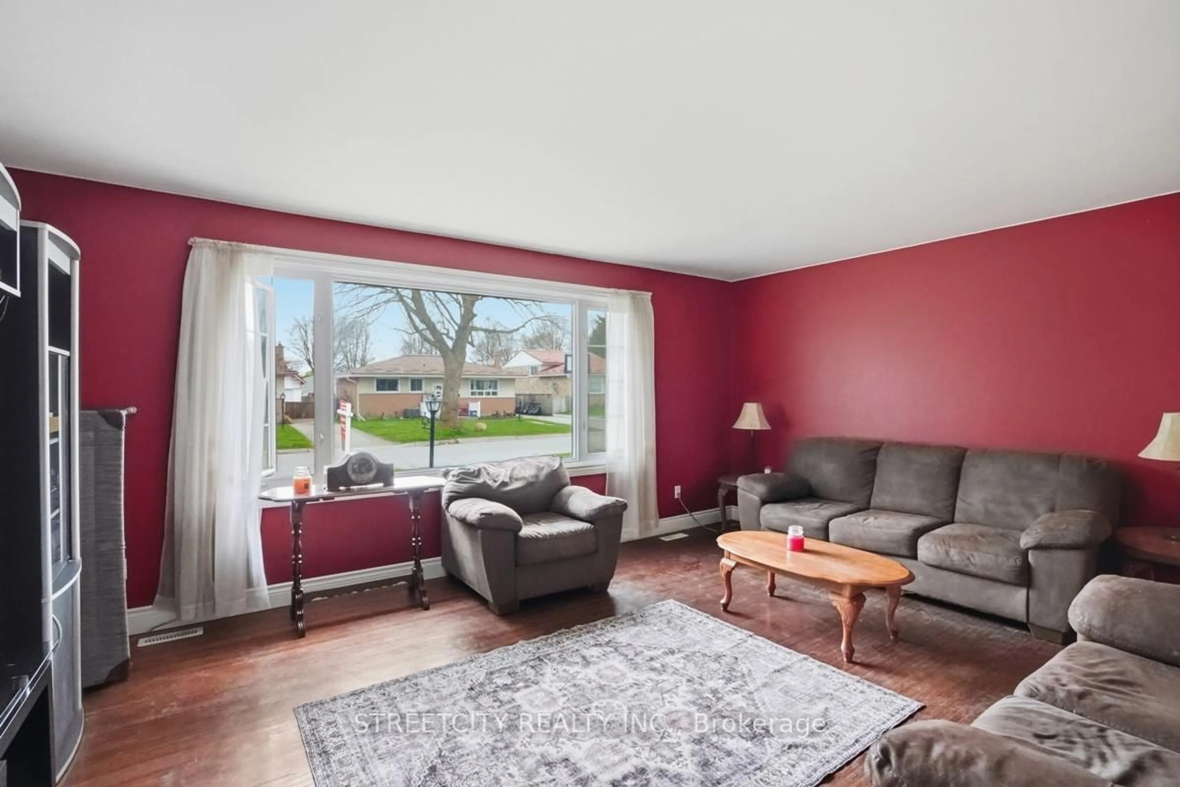 Living room with furniture, wood/laminate floor for 68 Talavera Cres, London East Ontario N5V 1K8