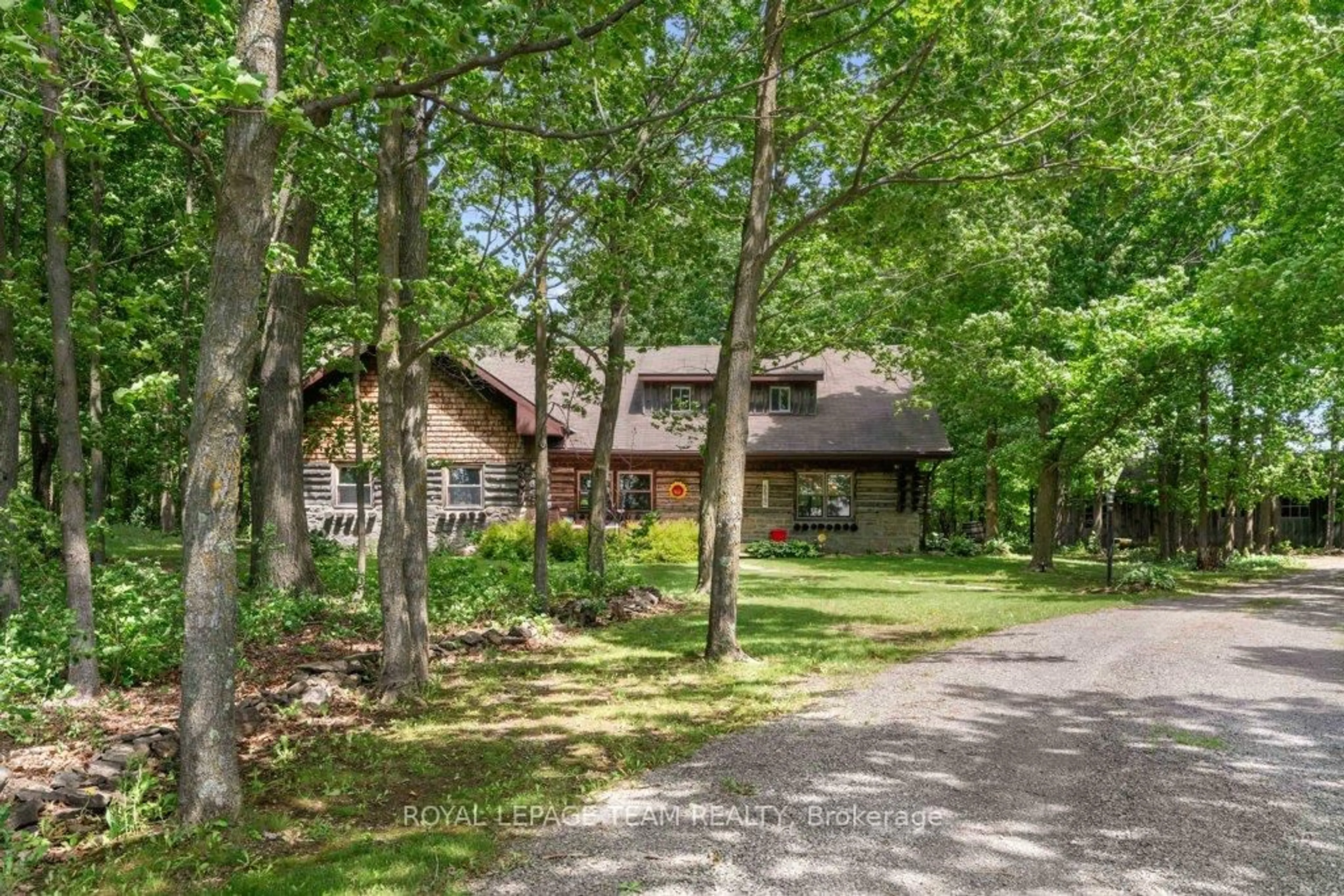 A pic from outside/outdoor area/front of a property/back of a property/a pic from drone, forest/trees view for 1462 Rideau River Rd, Montague Ontario K7A 8B8