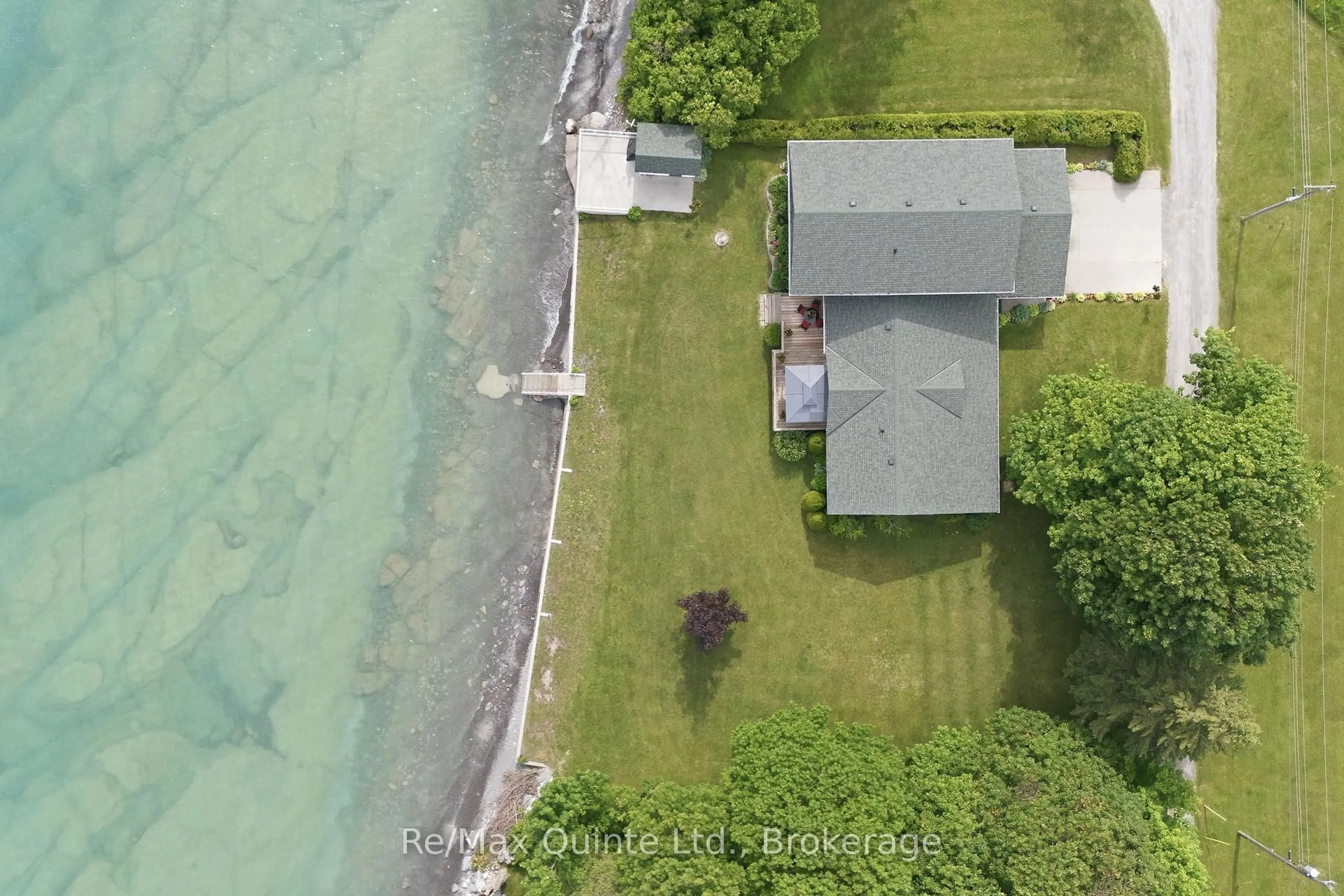 A pic from outside/outdoor area/front of a property/back of a property/a pic from drone, water/lake/river/ocean view for 29 Hyatt Lane, Prince Edward County Ontario K0K 2T0