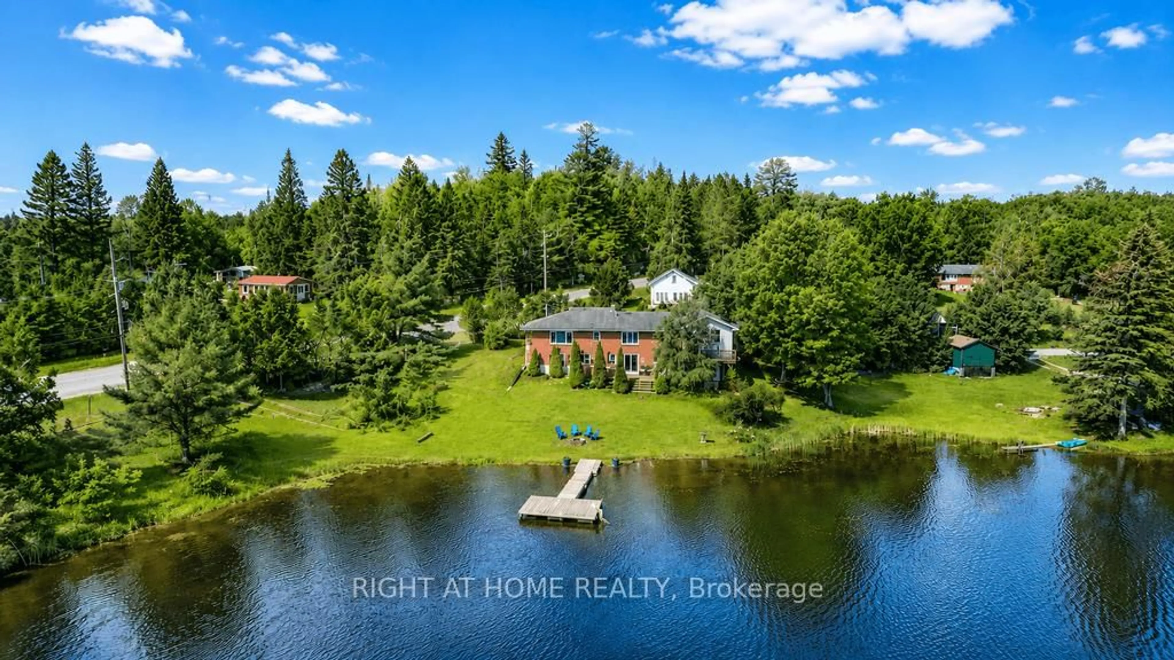 A pic from outside/outdoor area/front of a property/back of a property/a pic from drone, water/lake/river/ocean view for 1105 Pioneer Rd, Highlands East Ontario K0M 1R0