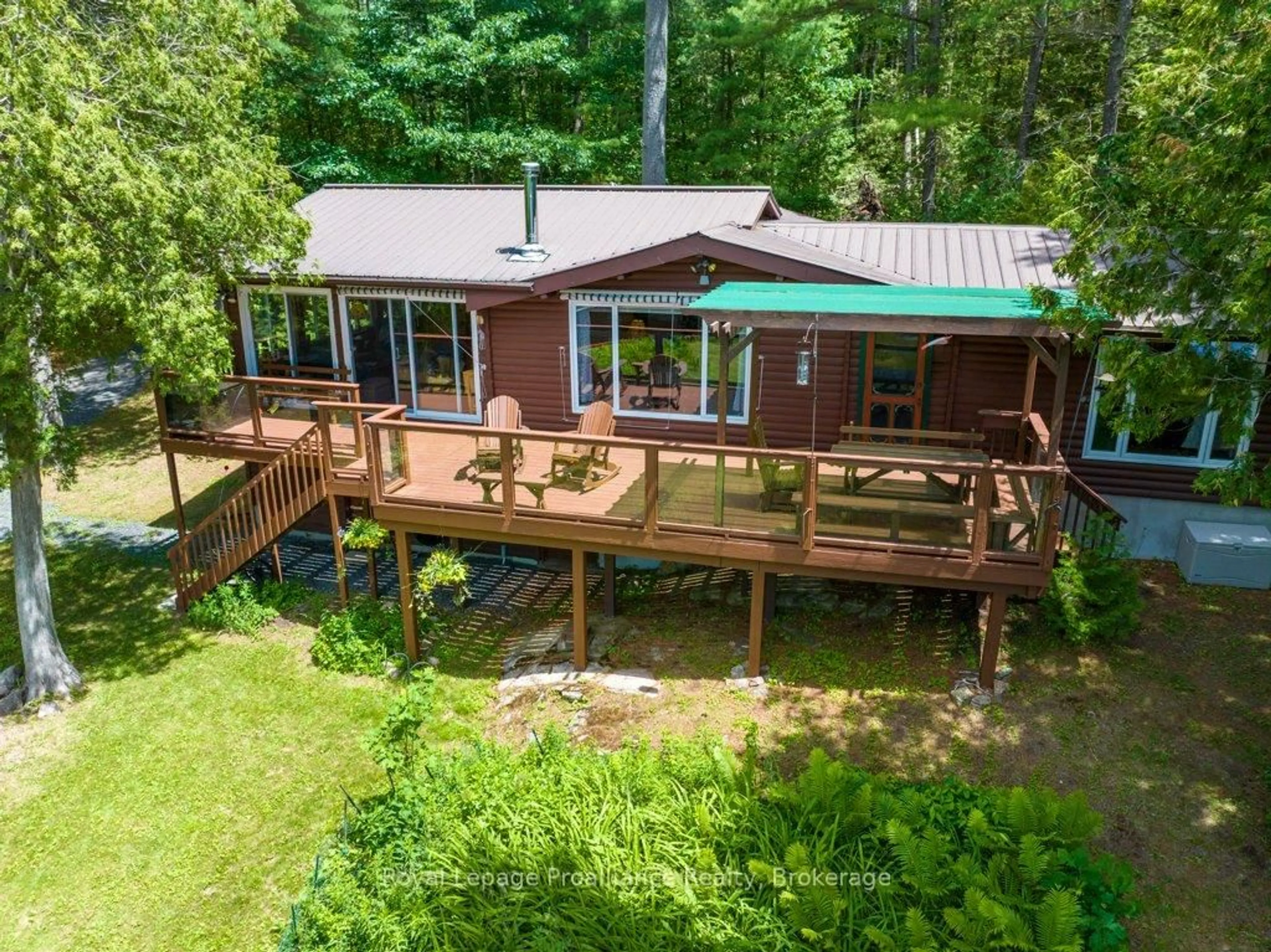 A pic from outside/outdoor area/front of a property/back of a property/a pic from drone, water/lake/river/ocean view for 1793A Hughes Landing Rd, Cloyne Ontario K0H 1K0