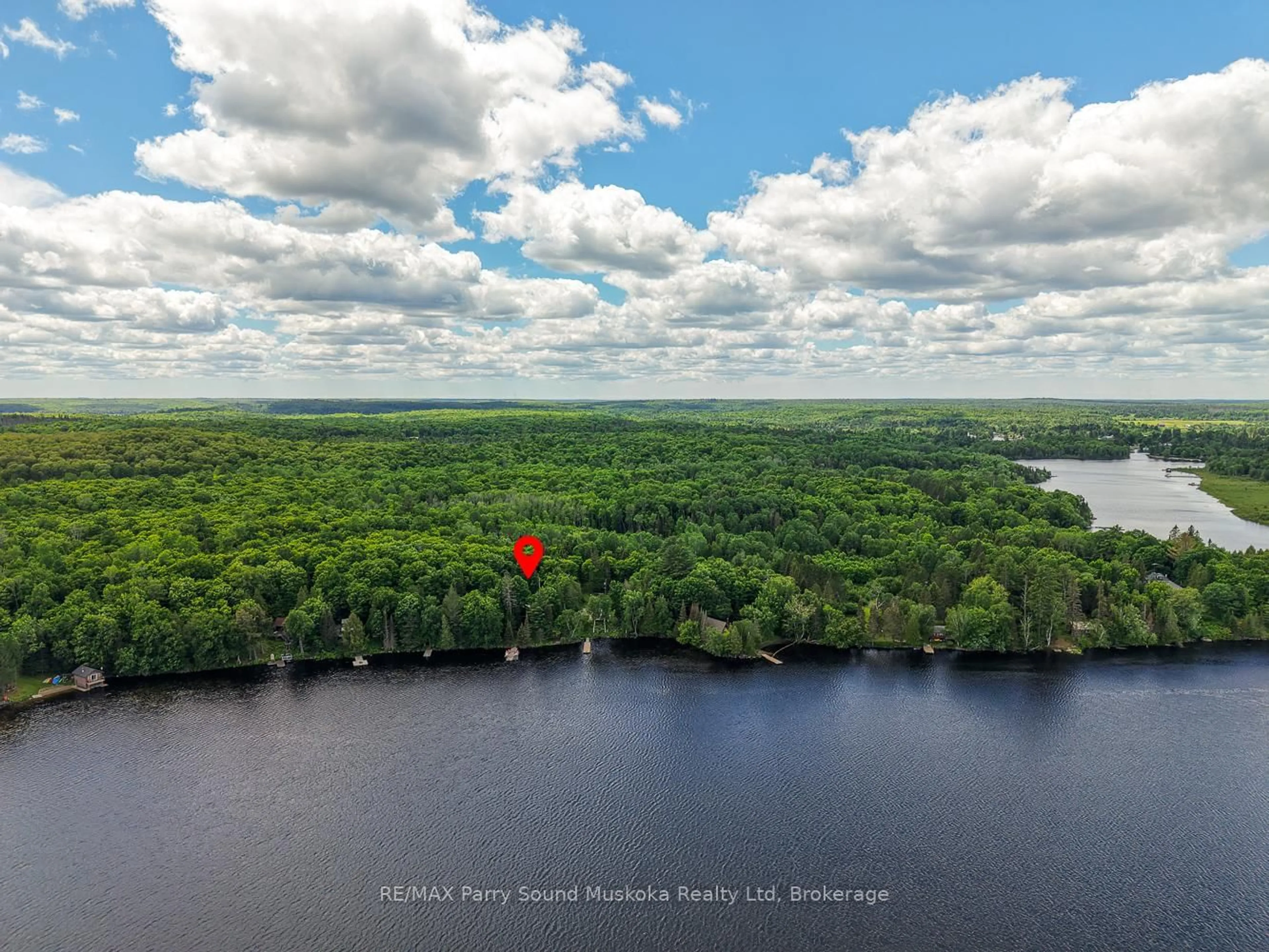 A pic from outside/outdoor area/front of a property/back of a property/a pic from drone, water/lake/river/ocean view for 147 Black Bear Rd, Magnetawan Ontario P0A 1C0